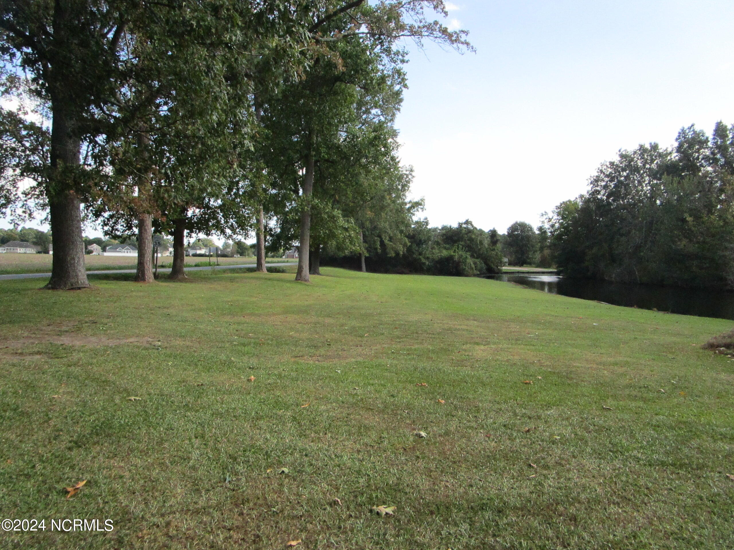 1818 River Road Elizabeth City, NC 27909 - Photo 2 of 45 Side yard on the canal