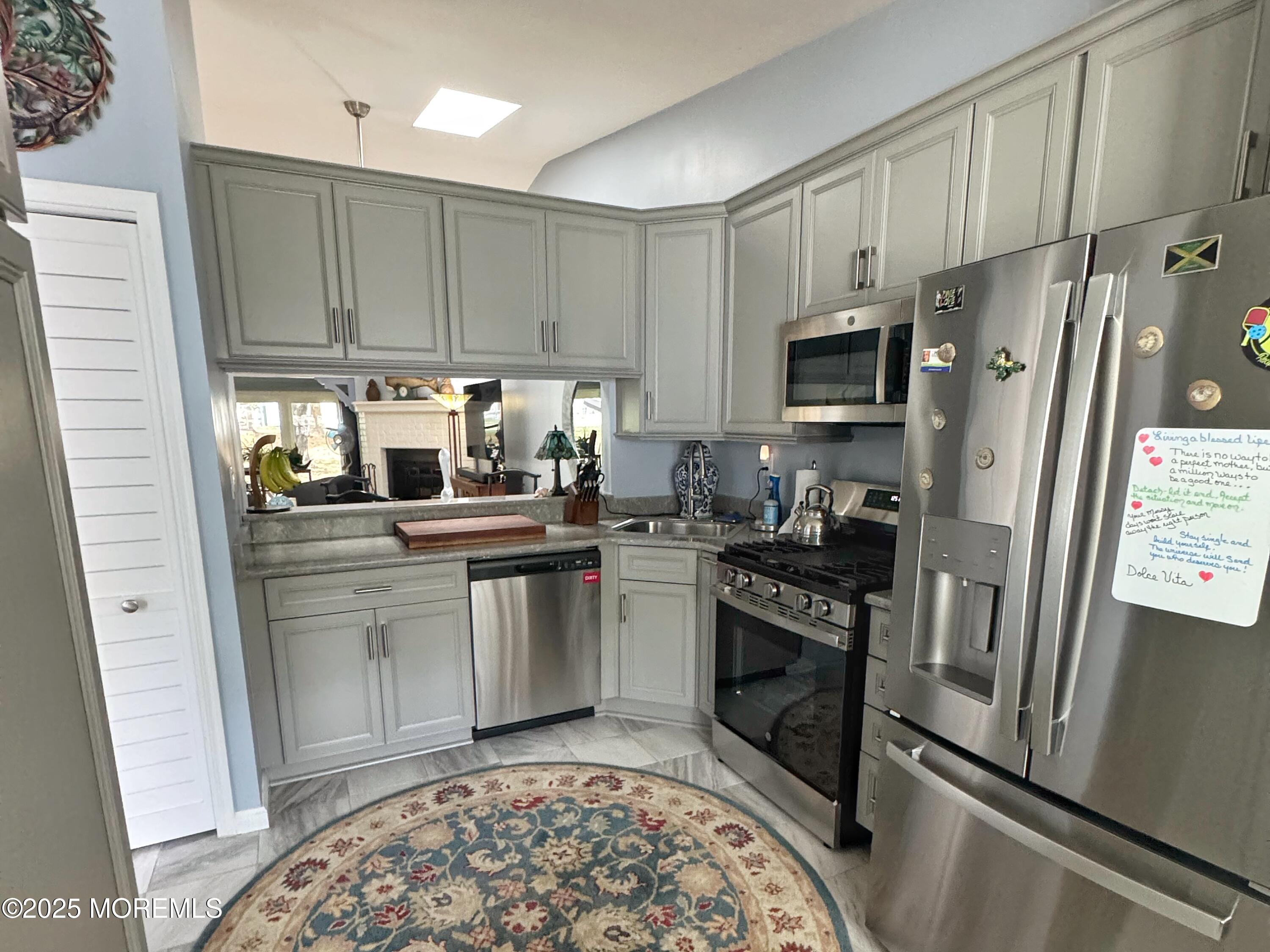 39 Boxwood Terrace Red Bank, NJ 07701 - Photo 11 of 25 a kitchen with a refrigerator stove and sink