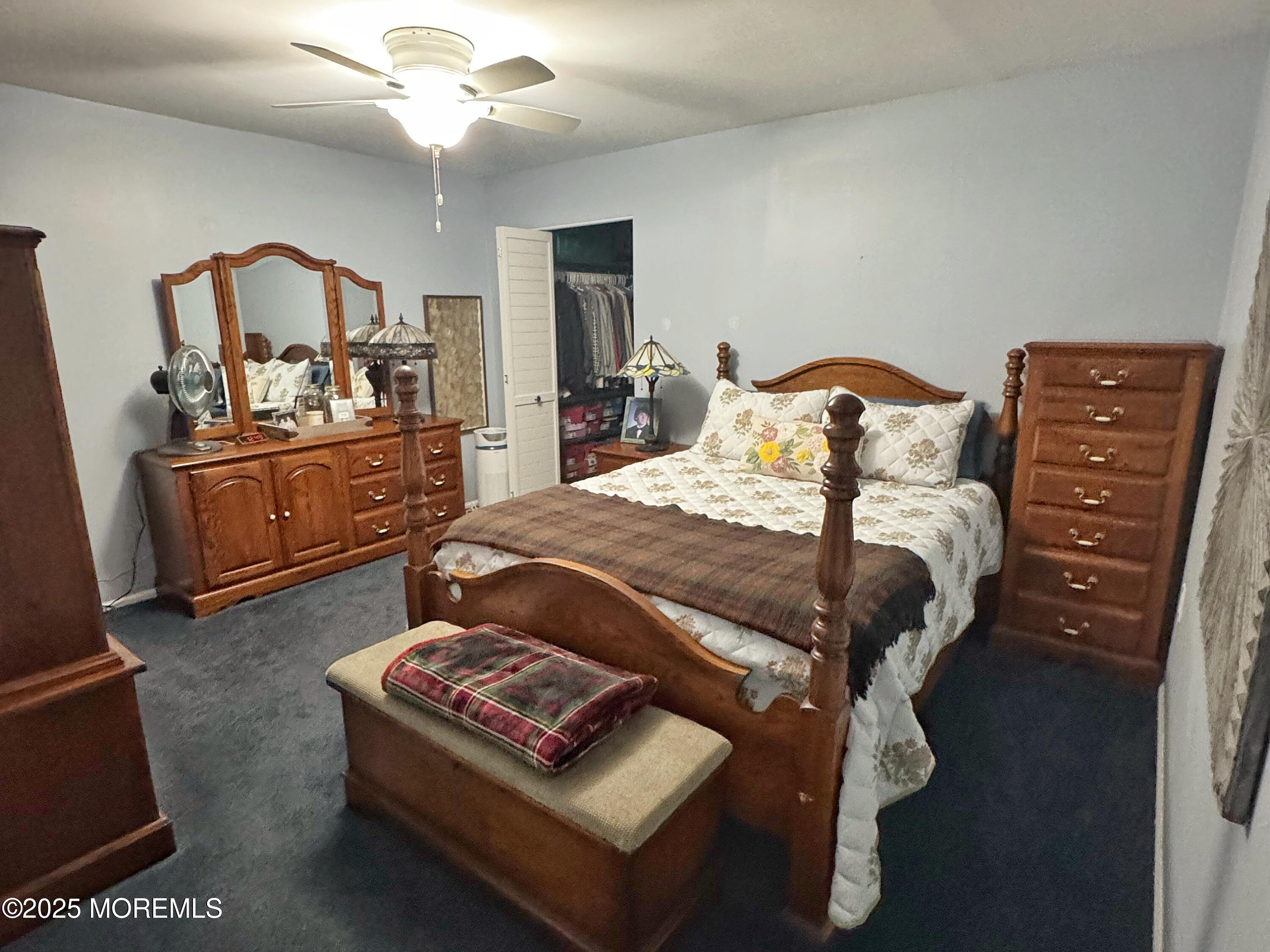 39 Boxwood Terrace Red Bank, NJ 07701 - Photo 15 of 25 a bed room with a bed and dresser