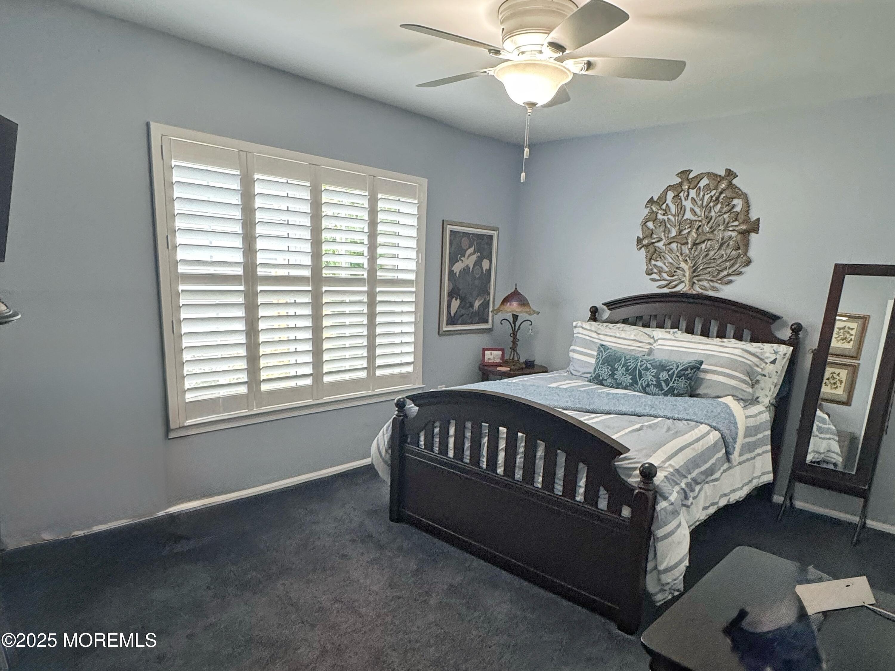 39 Boxwood Terrace Red Bank, NJ 07701 - Photo 19 of 25 a bed sitting in a bedroom next to a window