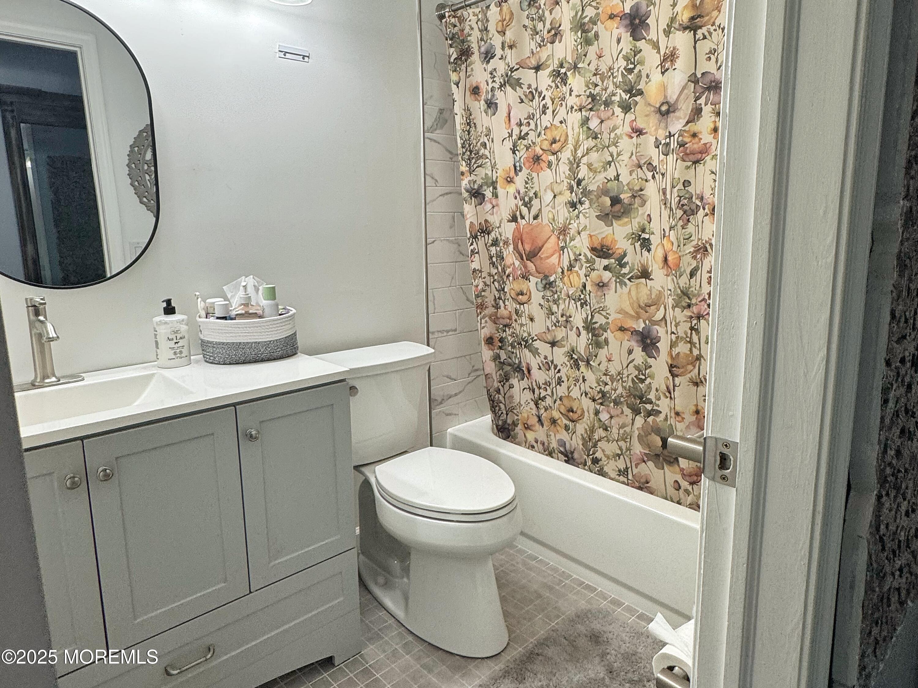 39 Boxwood Terrace Red Bank, NJ 07701 - Photo 21 of 25 a bathroom with a toilet sink and mirror
