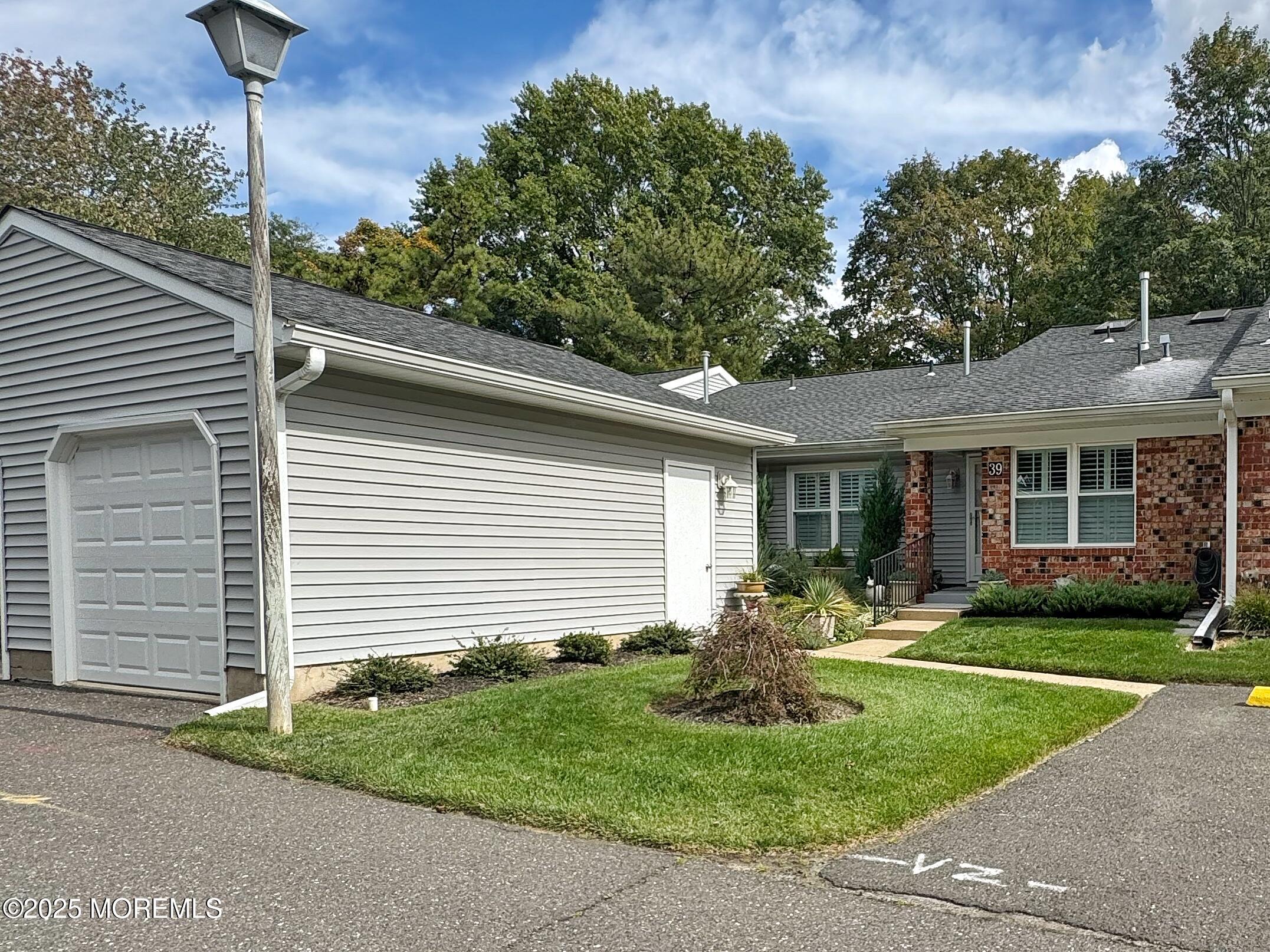 39 Boxwood Terrace Red Bank, NJ 07701 - Photo 22 of 25 a front view of a house with garden