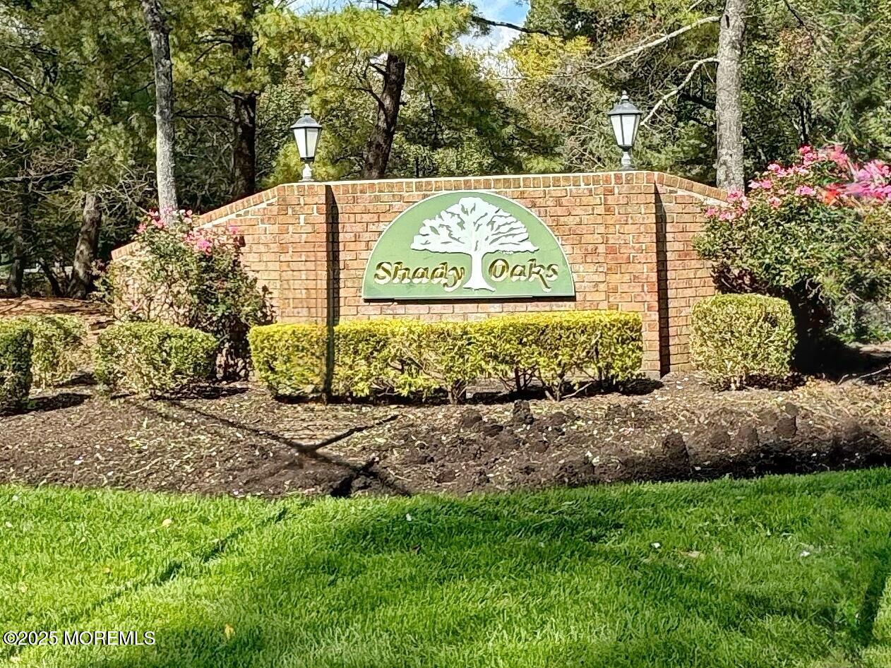 39 Boxwood Terrace Red Bank, NJ 07701 - Photo 23 of 25 a view of sign board with large trees