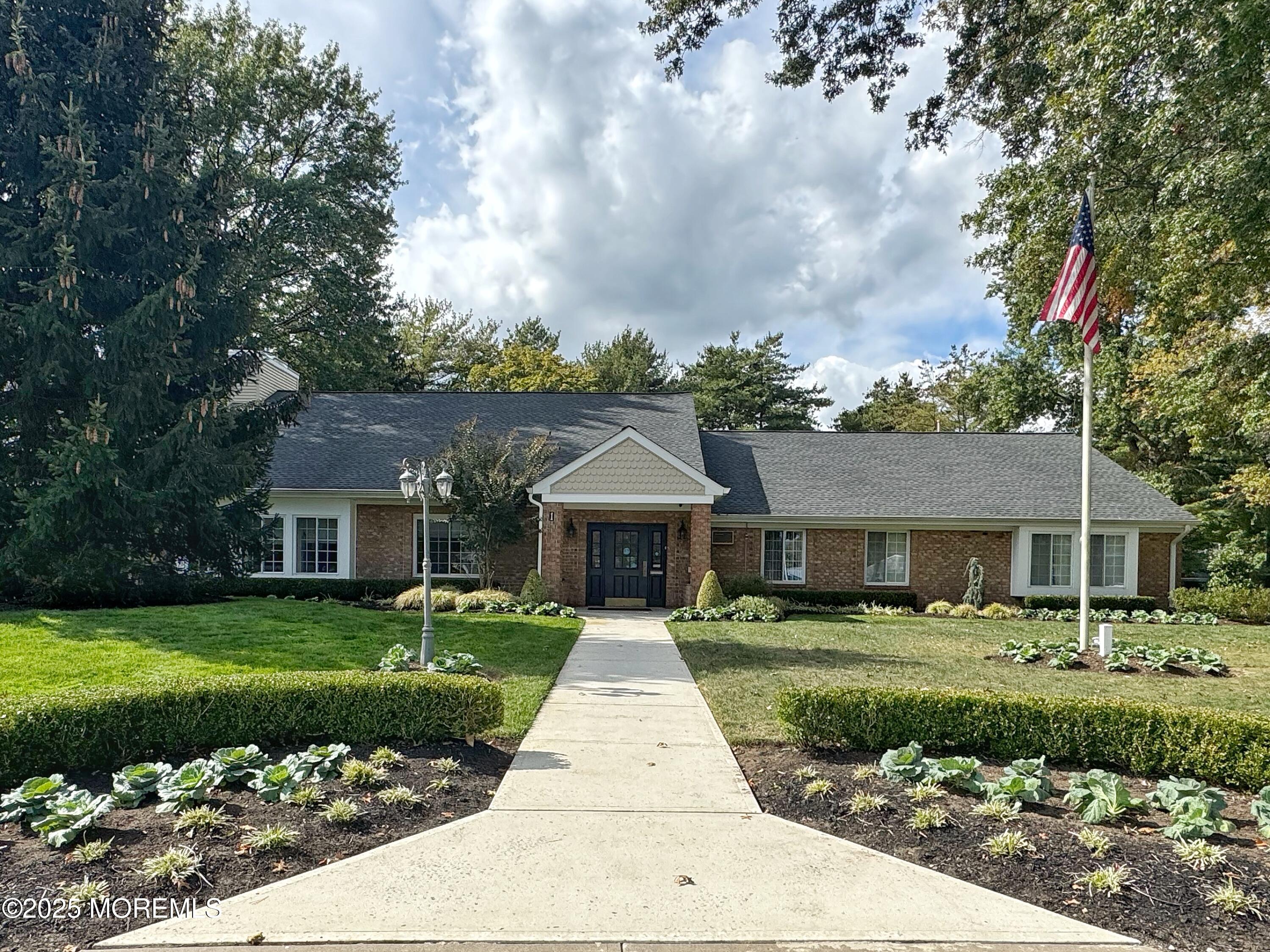 39 Boxwood Terrace Red Bank, NJ 07701 - Photo 24 of 25 a front view of a house with a yard