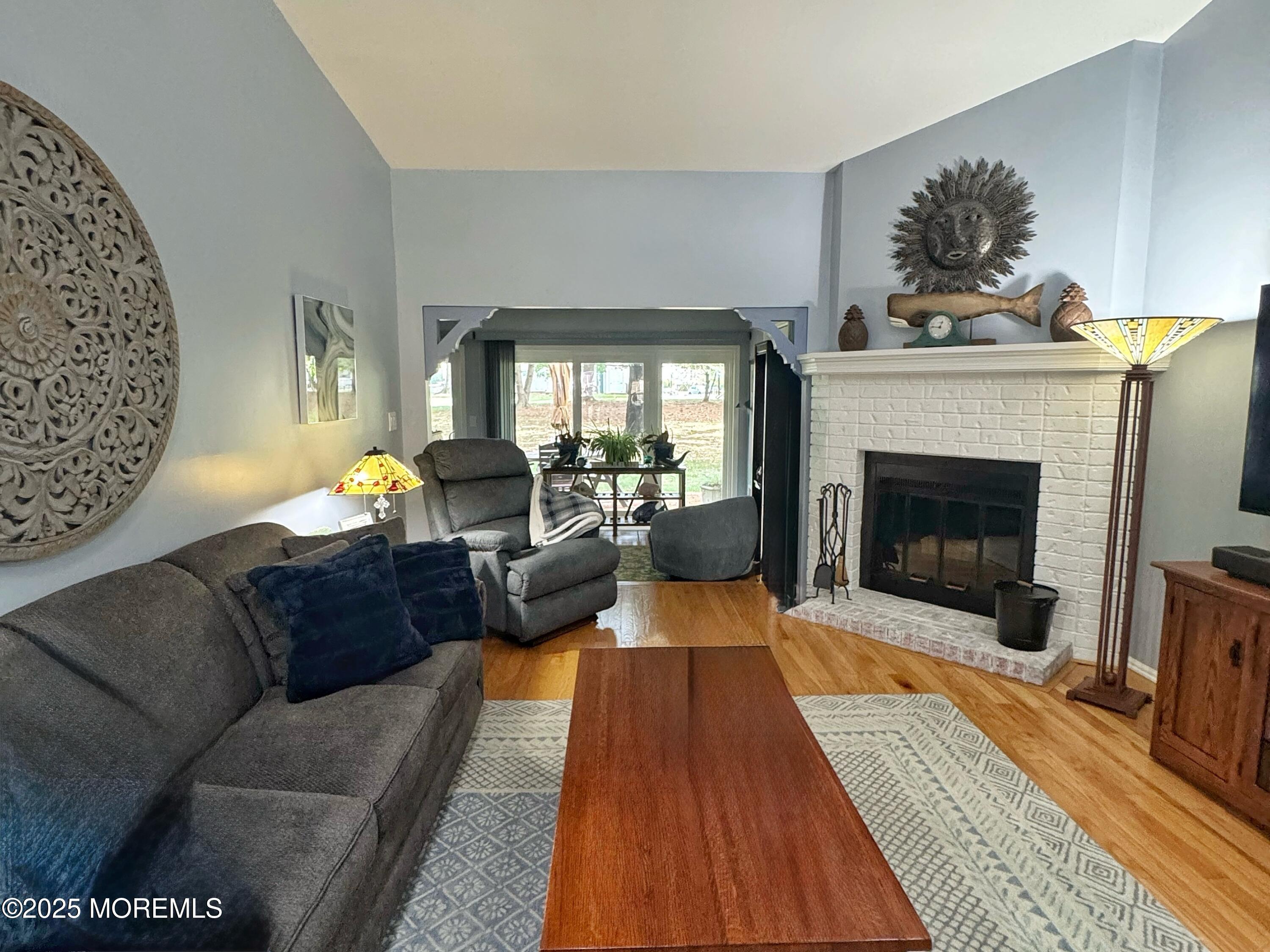 39 Boxwood Terrace Red Bank, NJ 07701 - Photo 4 of 25 a living room with furniture and a fireplace