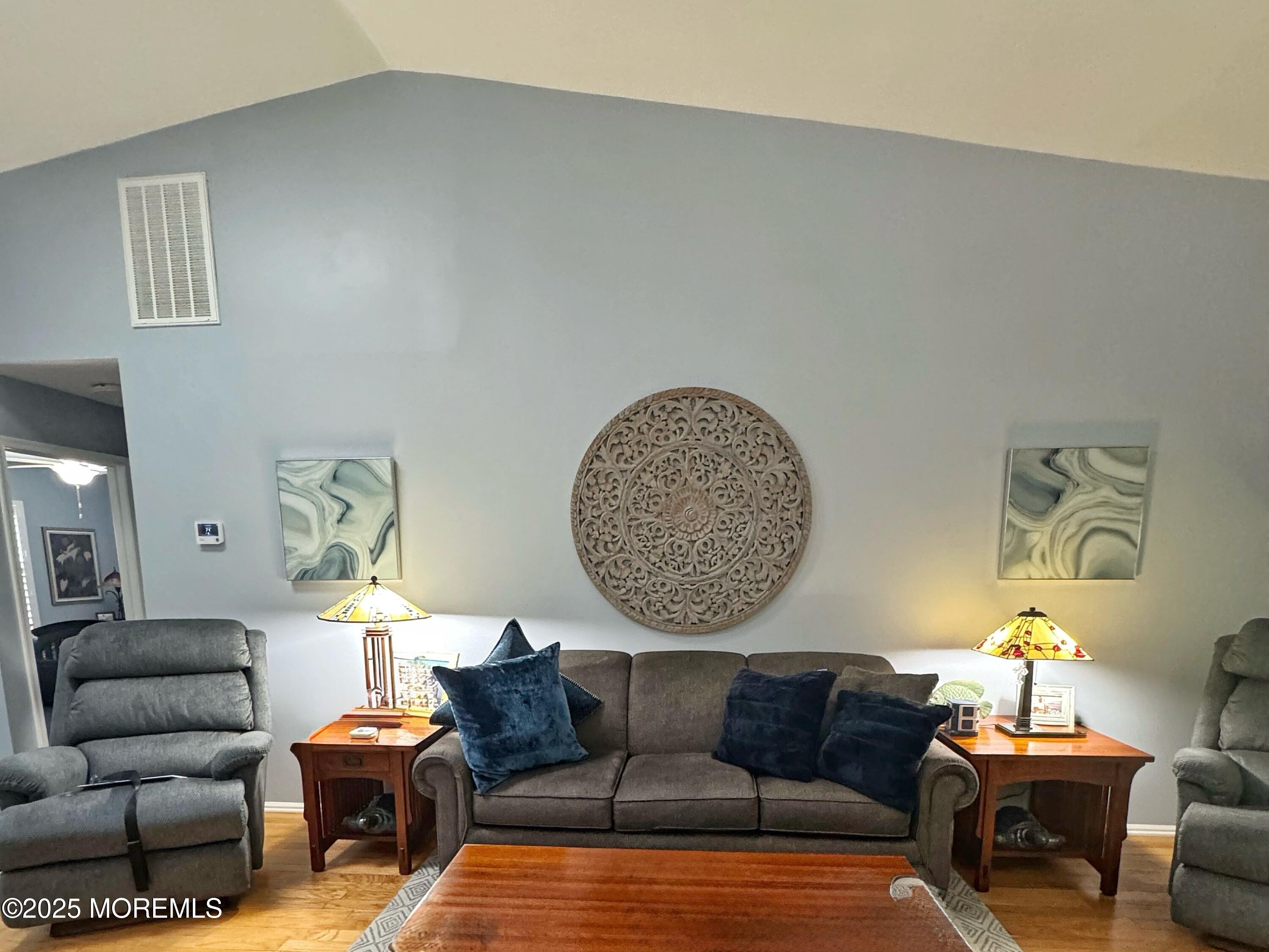 39 Boxwood Terrace Red Bank, NJ 07701 - Photo 6 of 25 a living room with furniture a rug and a lamp