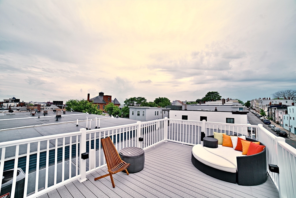 a view of roof deck with patio