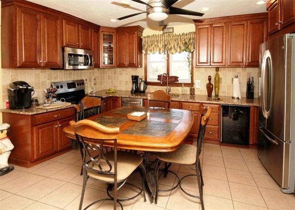 20 Primrose Street Springfield, MA 01151 - Photo 2 of 15 a kitchen with stainless steel appliances granite countertop a stove a sink a microwave and a refrigerator