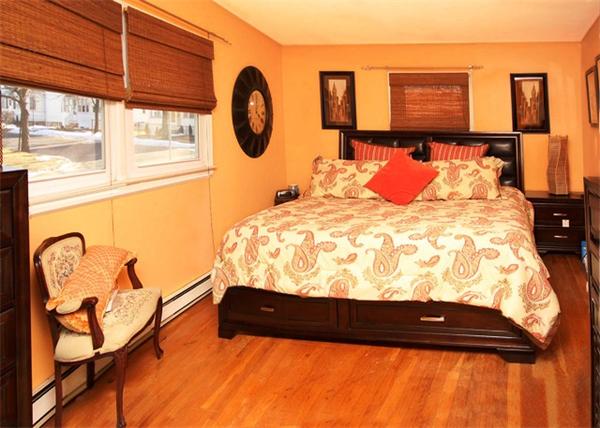 20 Primrose Street Springfield, MA 01151 - Photo 8 of 15 a bedroom with a bed and dresser with window