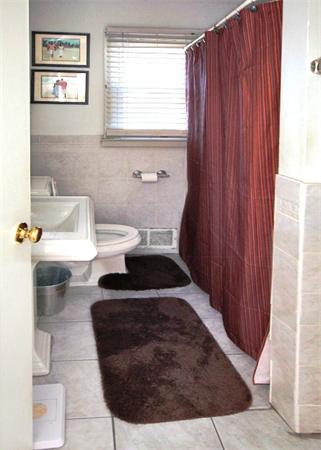 20 Primrose Street Springfield, MA 01151 - Photo 10 of 15 a bathroom with a toilet and a sink
