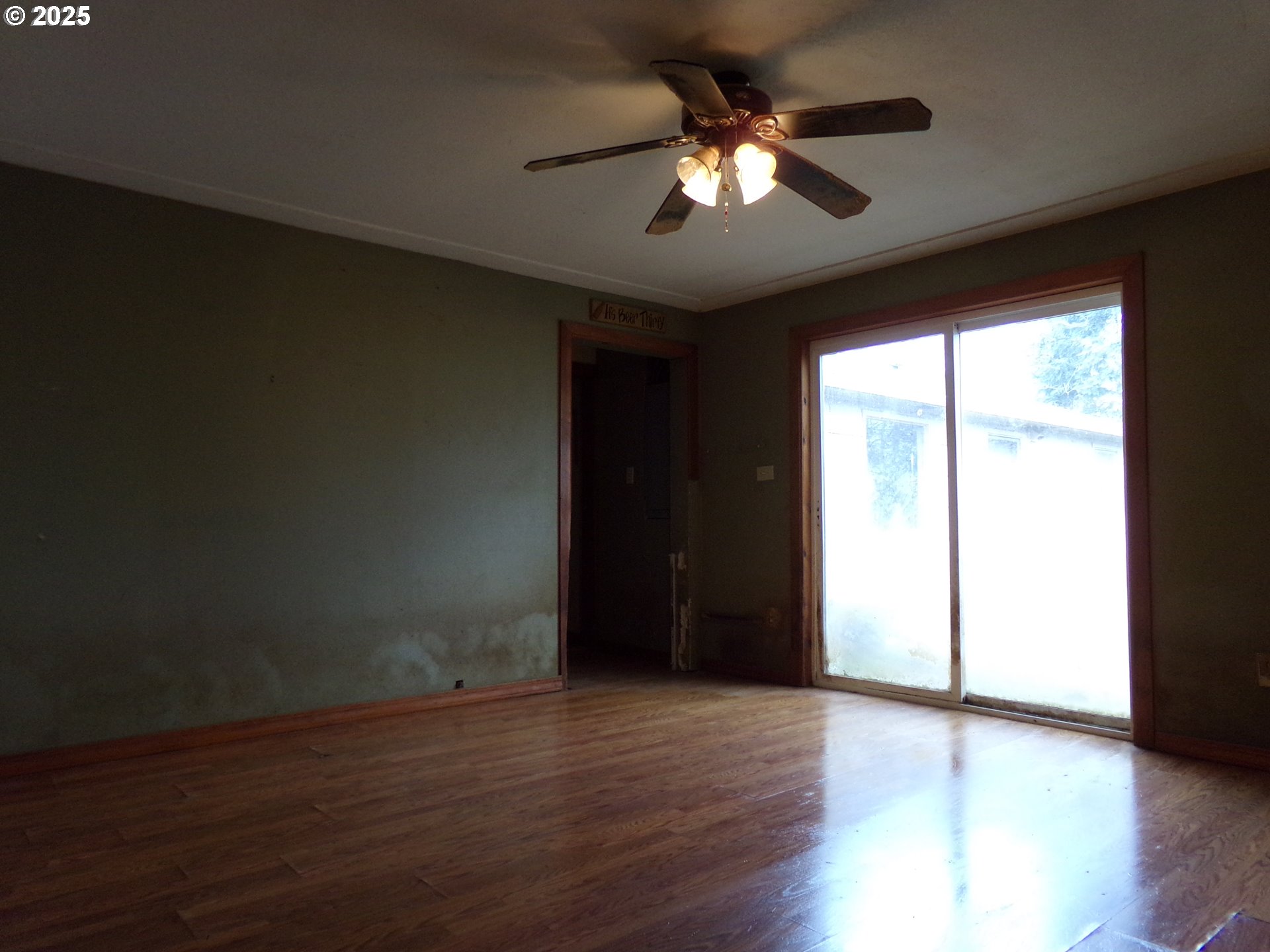 297 Arlene Avenue Southeast Salem, OR 97302 - Photo 15 of 16 a view of an empty room with wooden floor and a window