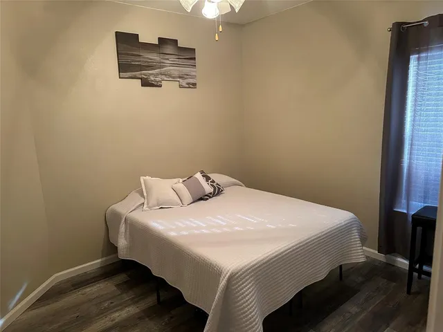 a bedroom with a bed and a cabinets