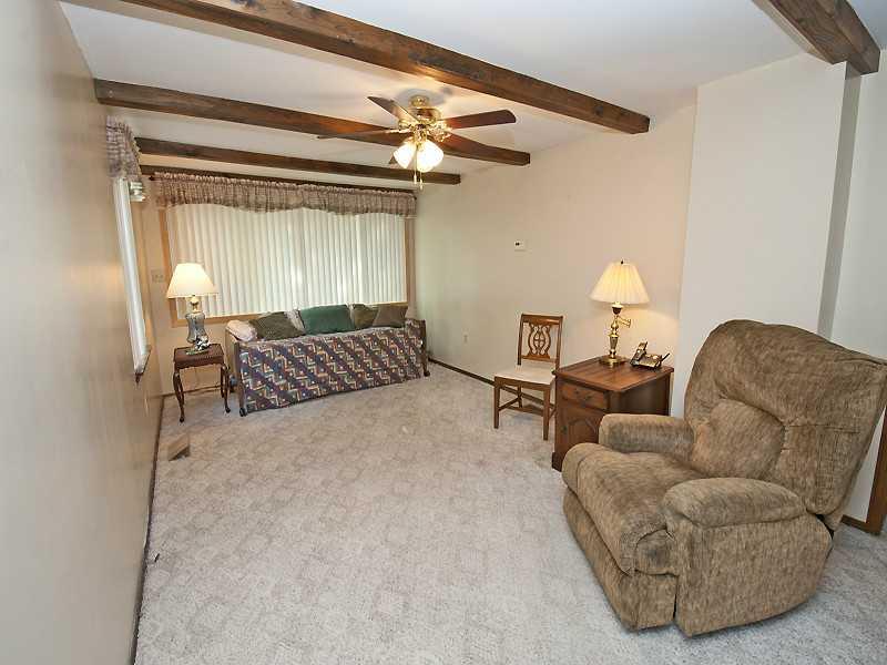 331 Rockfield Road Pittsburgh, PA 15243 - Photo 5 of 12 Family Room. 1st floor family room with door to deck and wide window to bring in outside views.