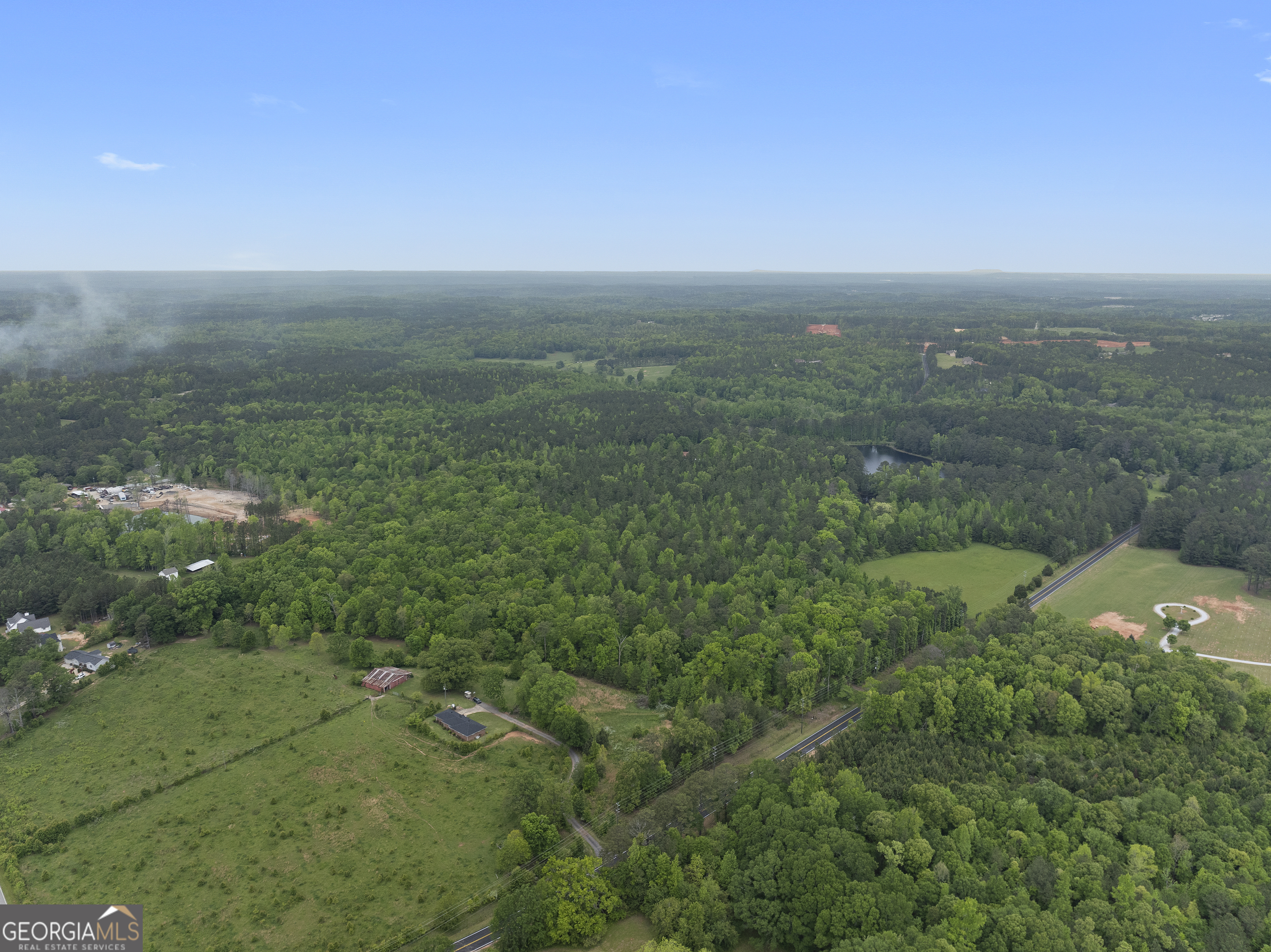 7357 Ono Road Palmetto, GA 30268 - Photo 9 of 15 an aerial view of residential houses with outdoor space and trees