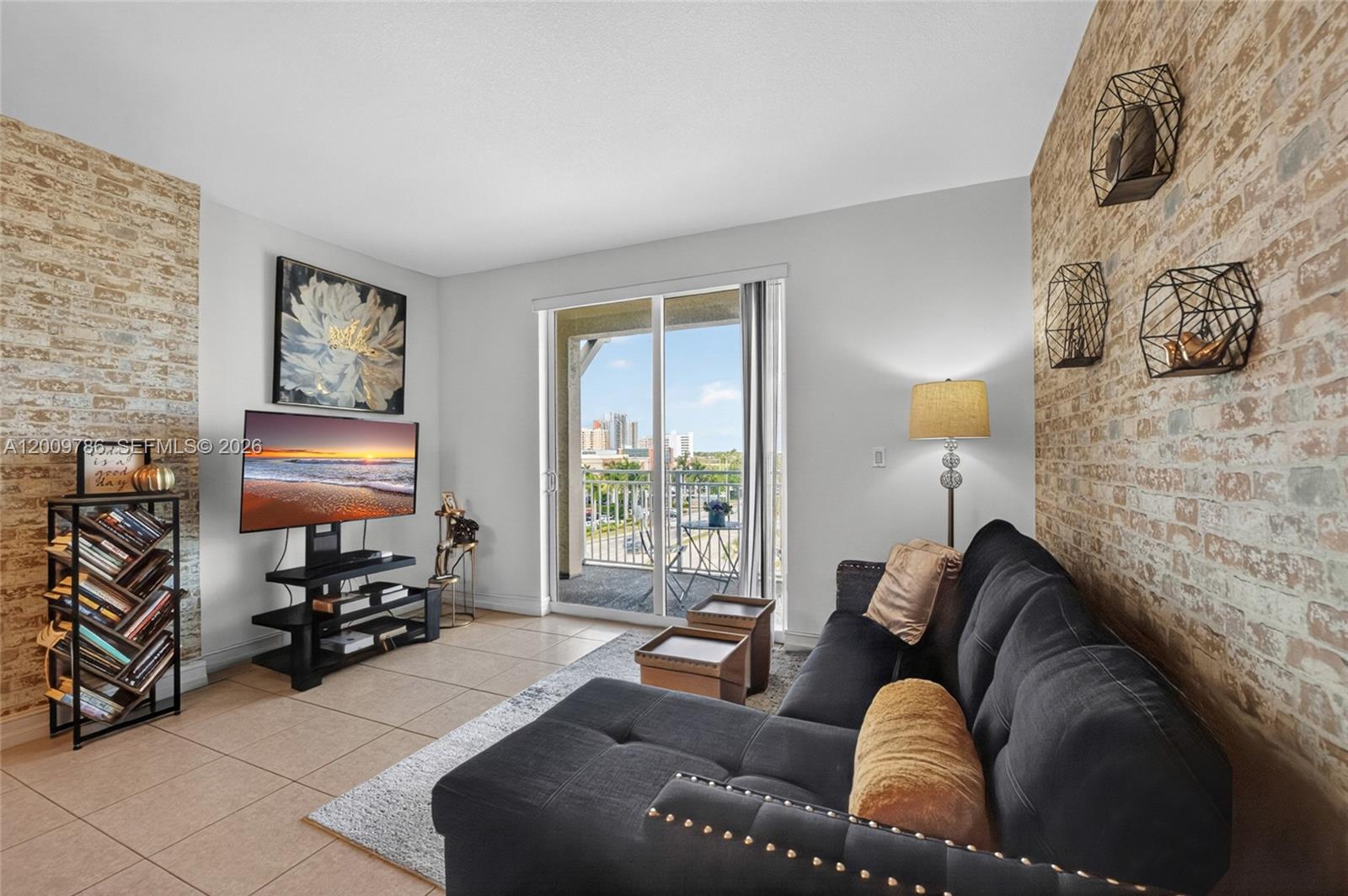 7266 Southwest 88th Street, Unit A403 Miami, FL 33156 - Photo 13 of 32 a living room with furniture and a window