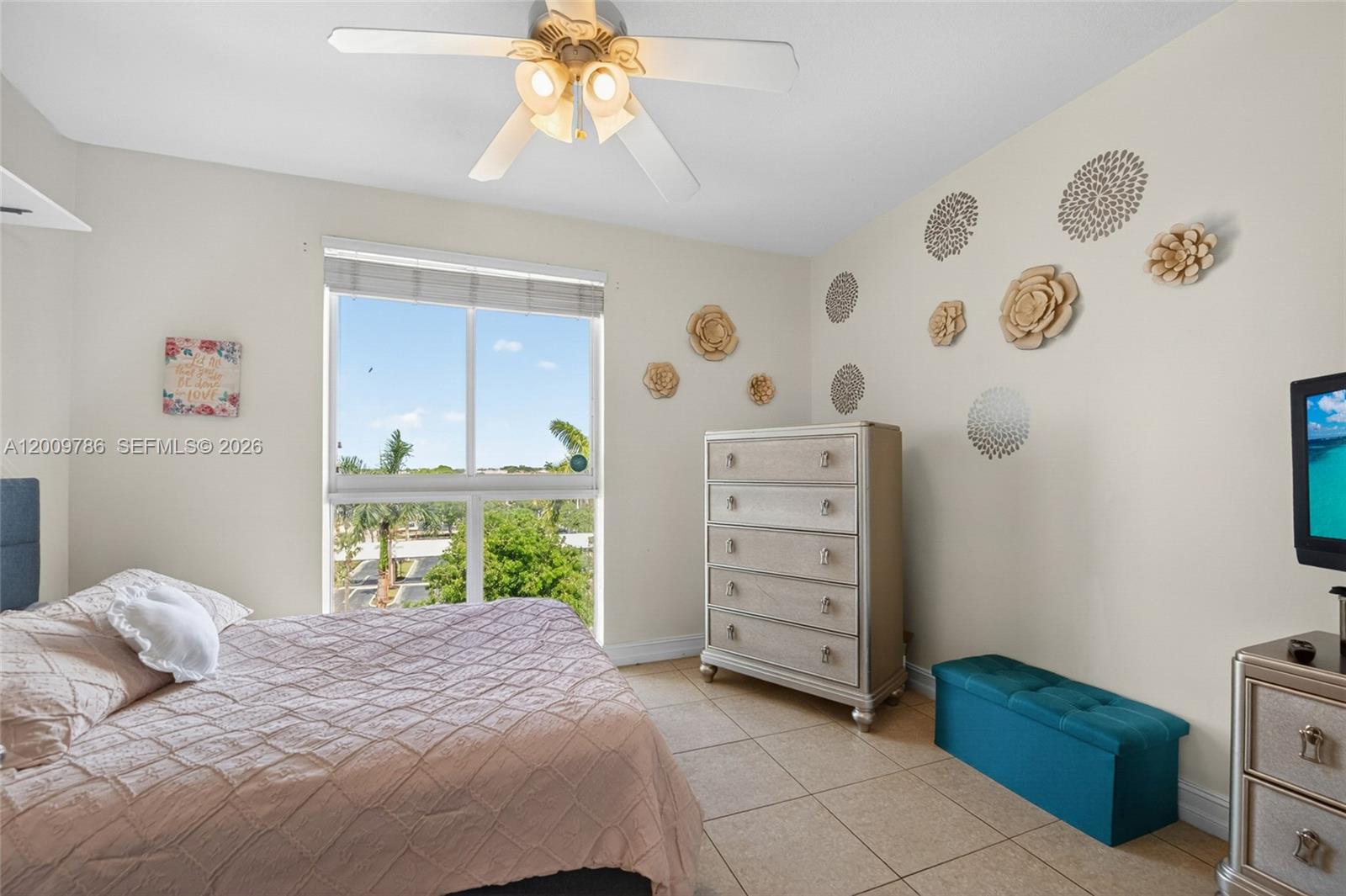 7266 Southwest 88th Street, Unit A403 Miami, FL 33156 - Photo 19 of 32 a bedroom with a bed and a dresser