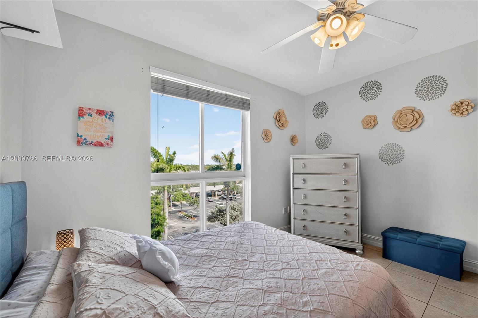 7266 Southwest 88th Street, Unit A403 Miami, FL 33156 - Photo 20 of 32 a bedroom with a bed and a dresser in it