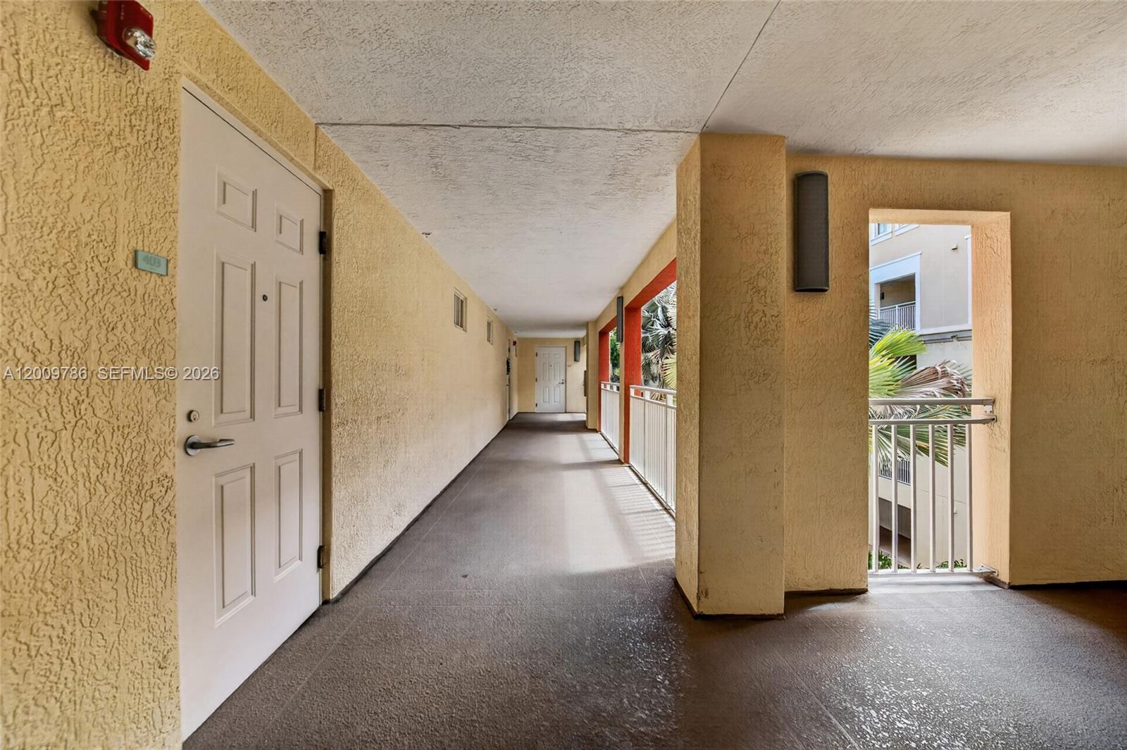7266 Southwest 88th Street, Unit A403 Miami, FL 33156 - Photo 2 of 32 a view of a hallway with closet area