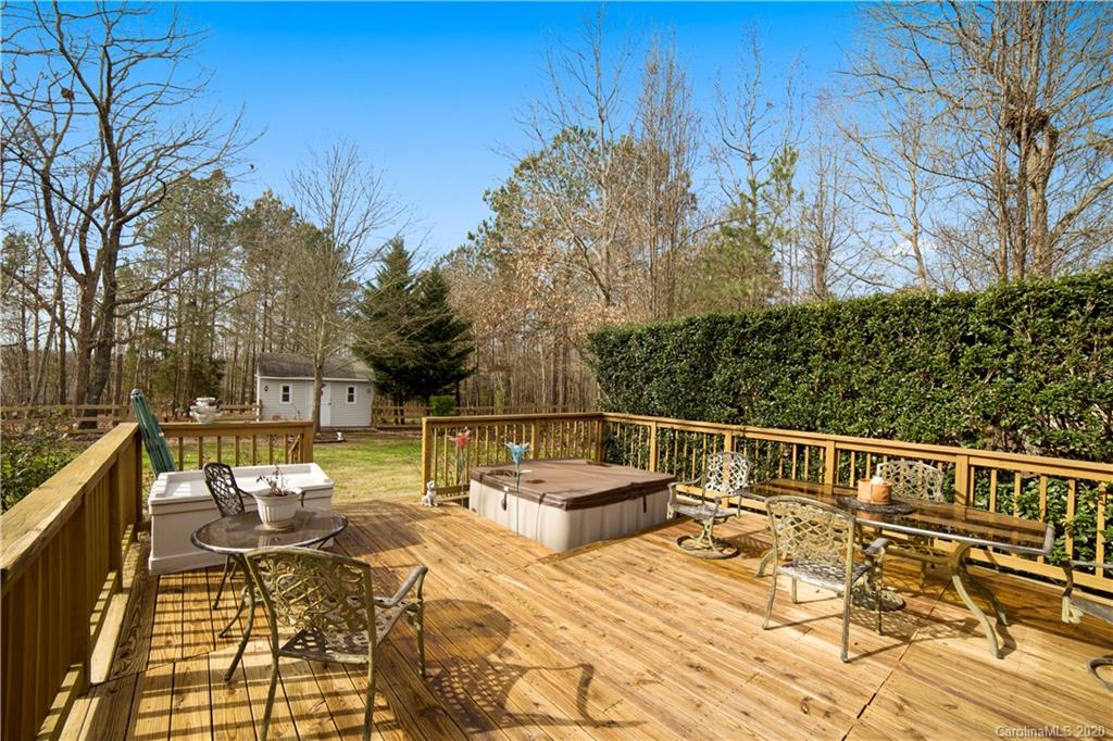 346 Nora Ridge Catawba, SC 29704 - Photo 26 of 29 a view of a patio with dining table and chairs with wooden floor and fence