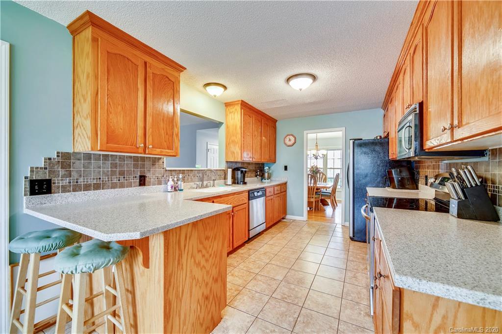 346 Nora Ridge Catawba, SC 29704 - Photo 6 of 29 a kitchen with stainless steel appliances granite countertop a sink a stove counter space and cabinets