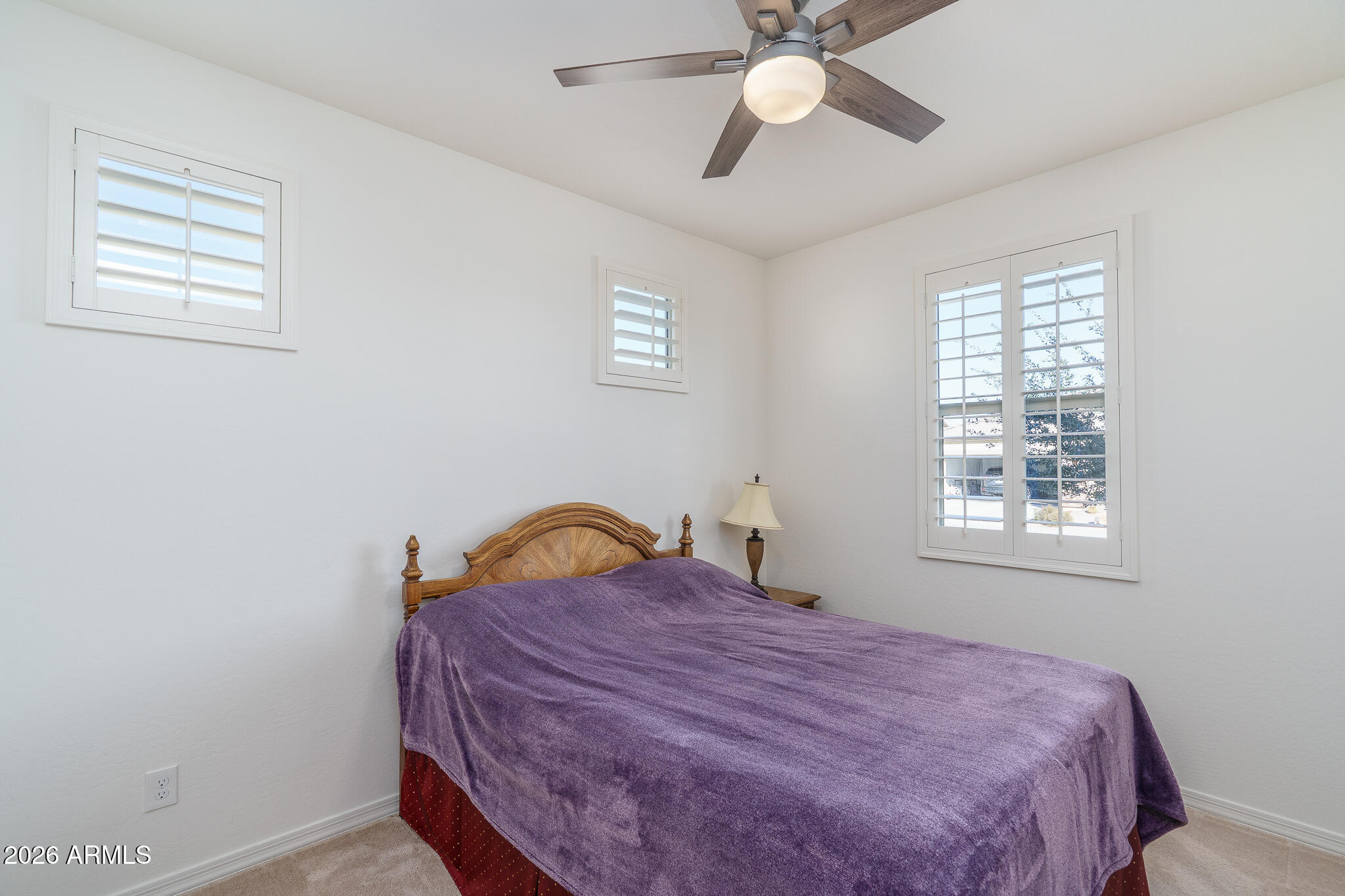 18127 West Fairview Street Goodyear, AZ 85338 - Photo 11 of 48 a bedroom with a bed and a window