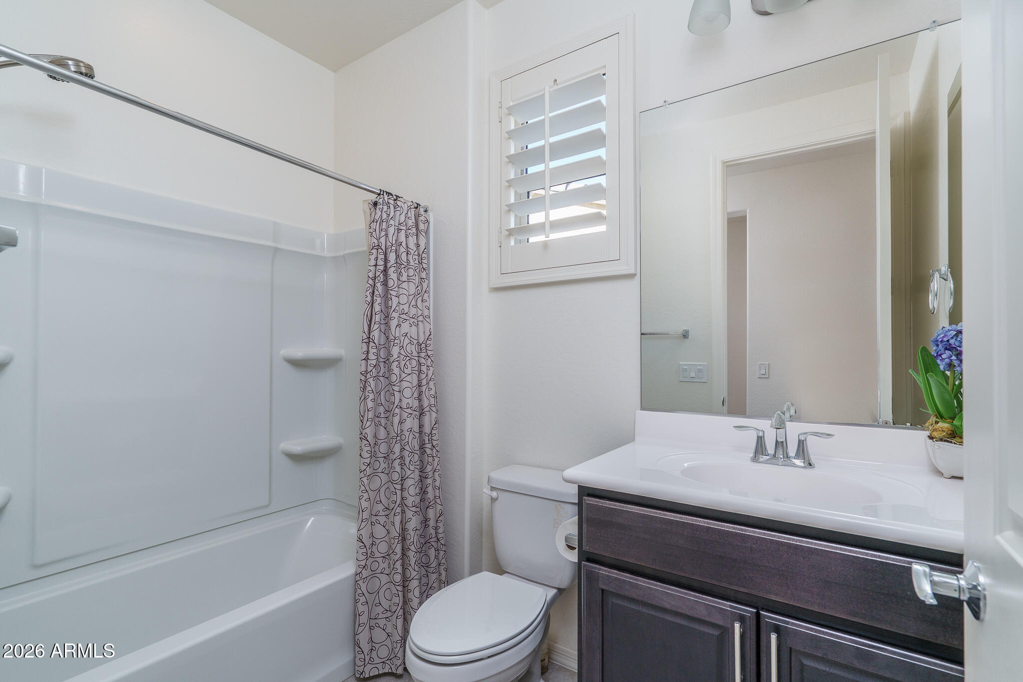 18127 West Fairview Street Goodyear, AZ 85338 - Photo 12 of 48 a bathroom with a sink toilet and shower