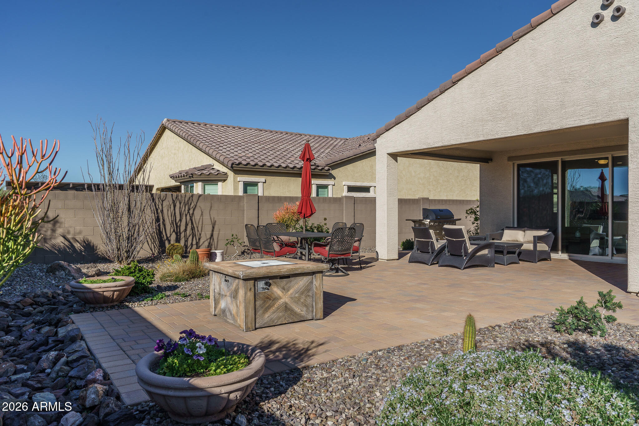 18127 West Fairview Street Goodyear, AZ 85338 - Photo 20 of 48 a view of a backyard with sitting area and furniture