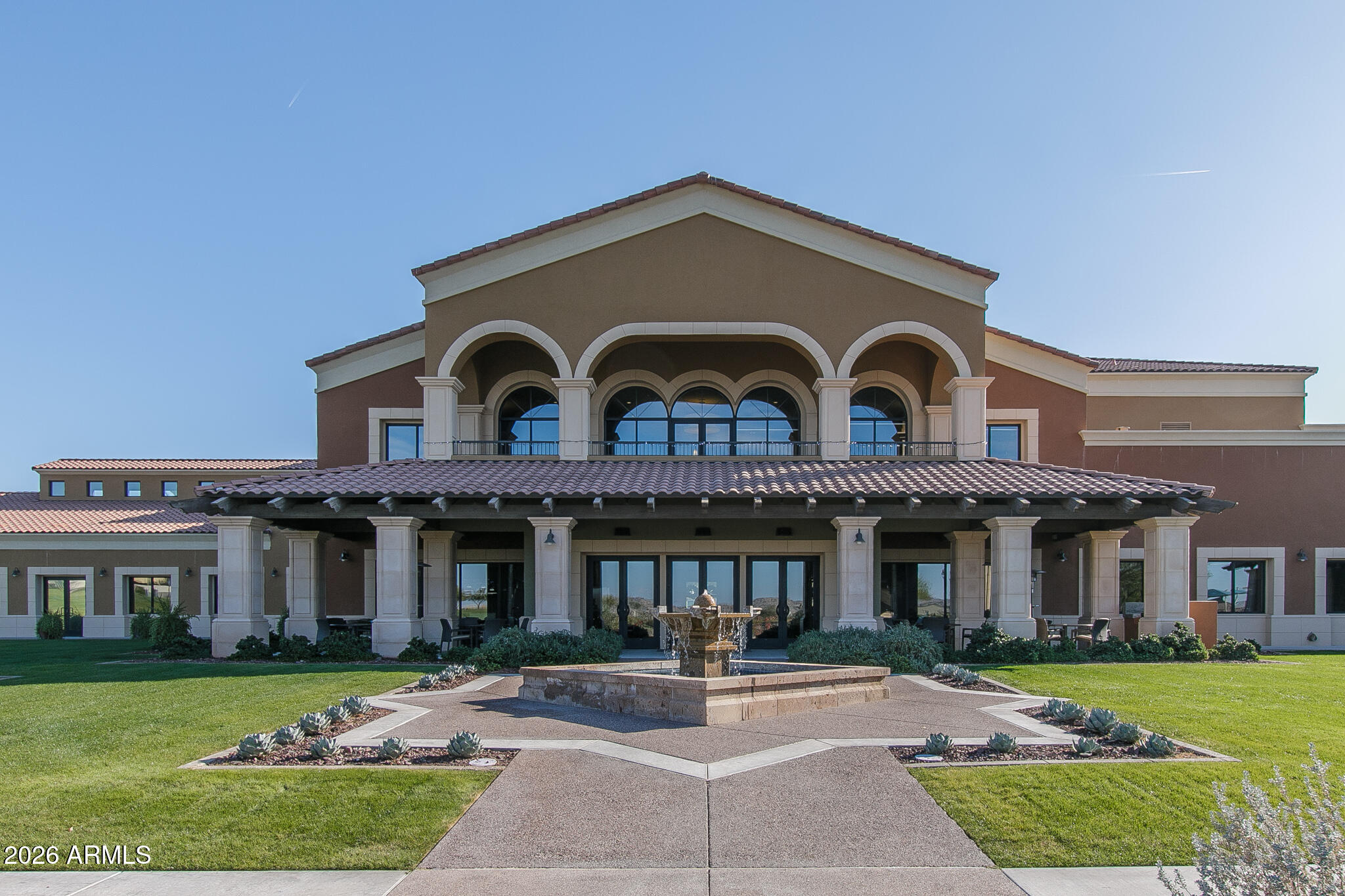 18127 West Fairview Street Goodyear, AZ 85338 - Photo 37 of 48 a front view of a residential apartment building with a yard