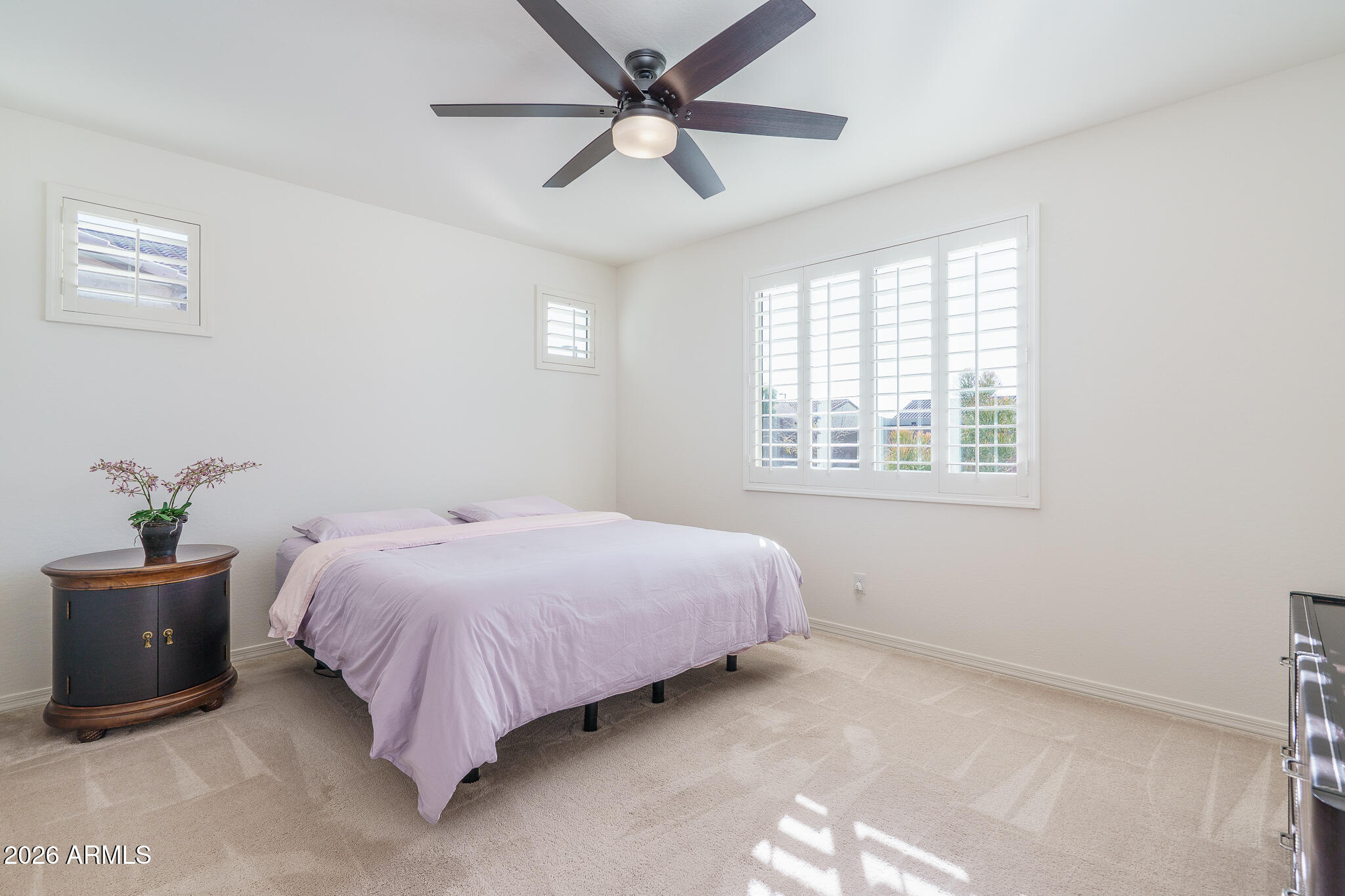 18127 West Fairview Street Goodyear, AZ 85338 - Photo 8 of 48 a bedroom with a bed and a window