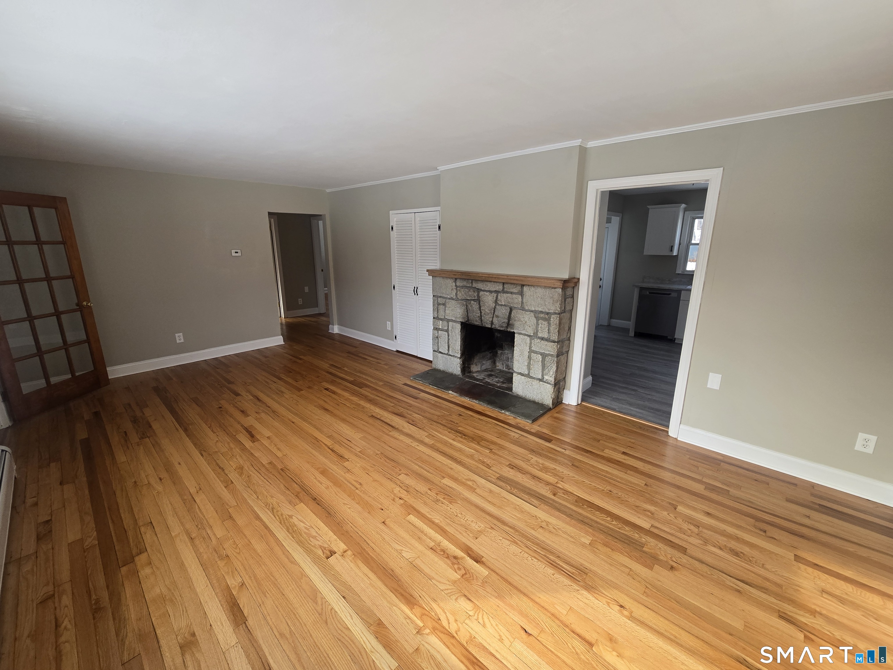 3 Myrtle Avenue Danbury, CT 06810 - Photo 3 of 11 wooden floor fireplace and natural light in room