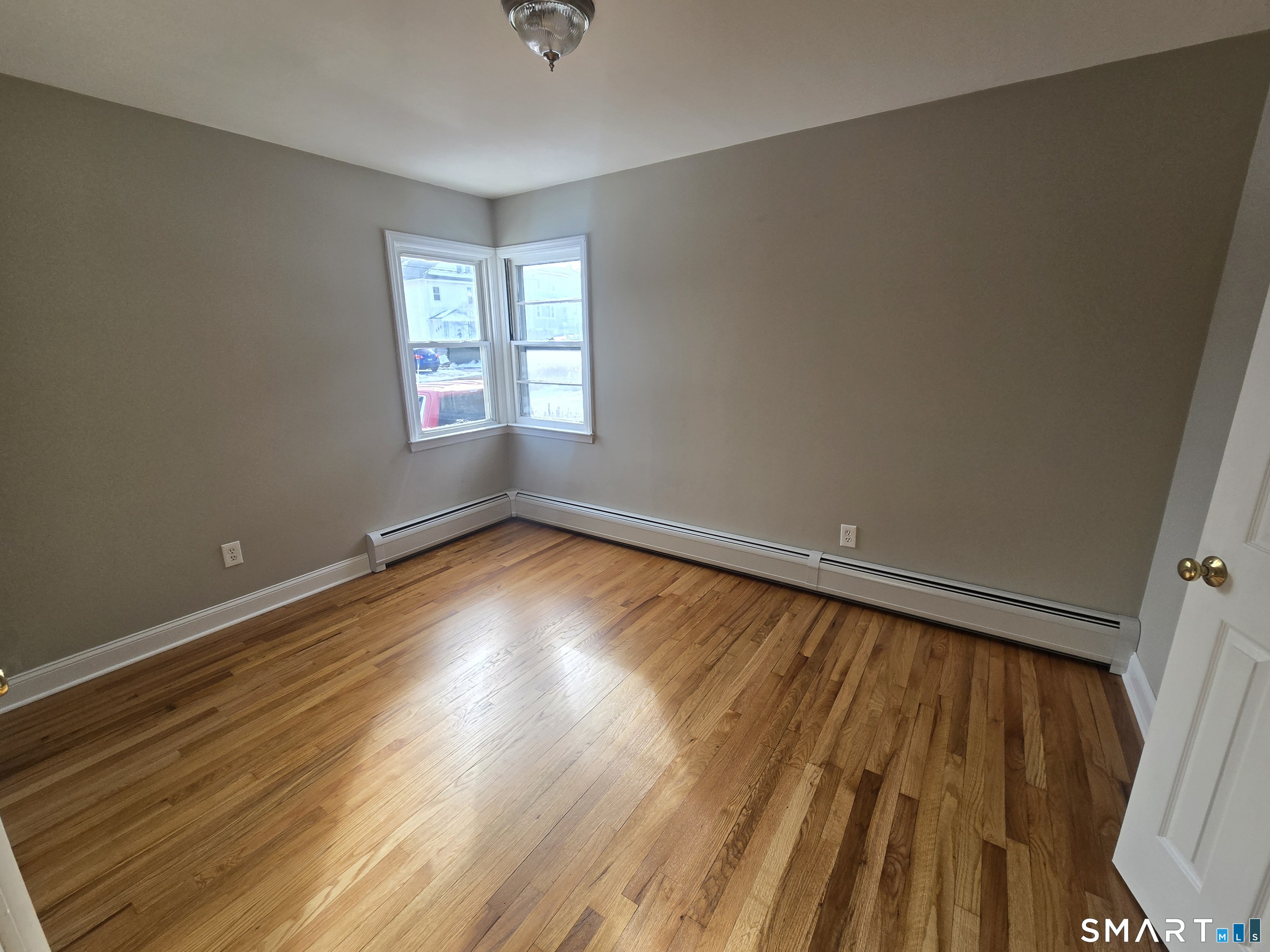 3 Myrtle Avenue Danbury, CT 06810 - Photo 6 of 11 wooden floor in an empty room with a window