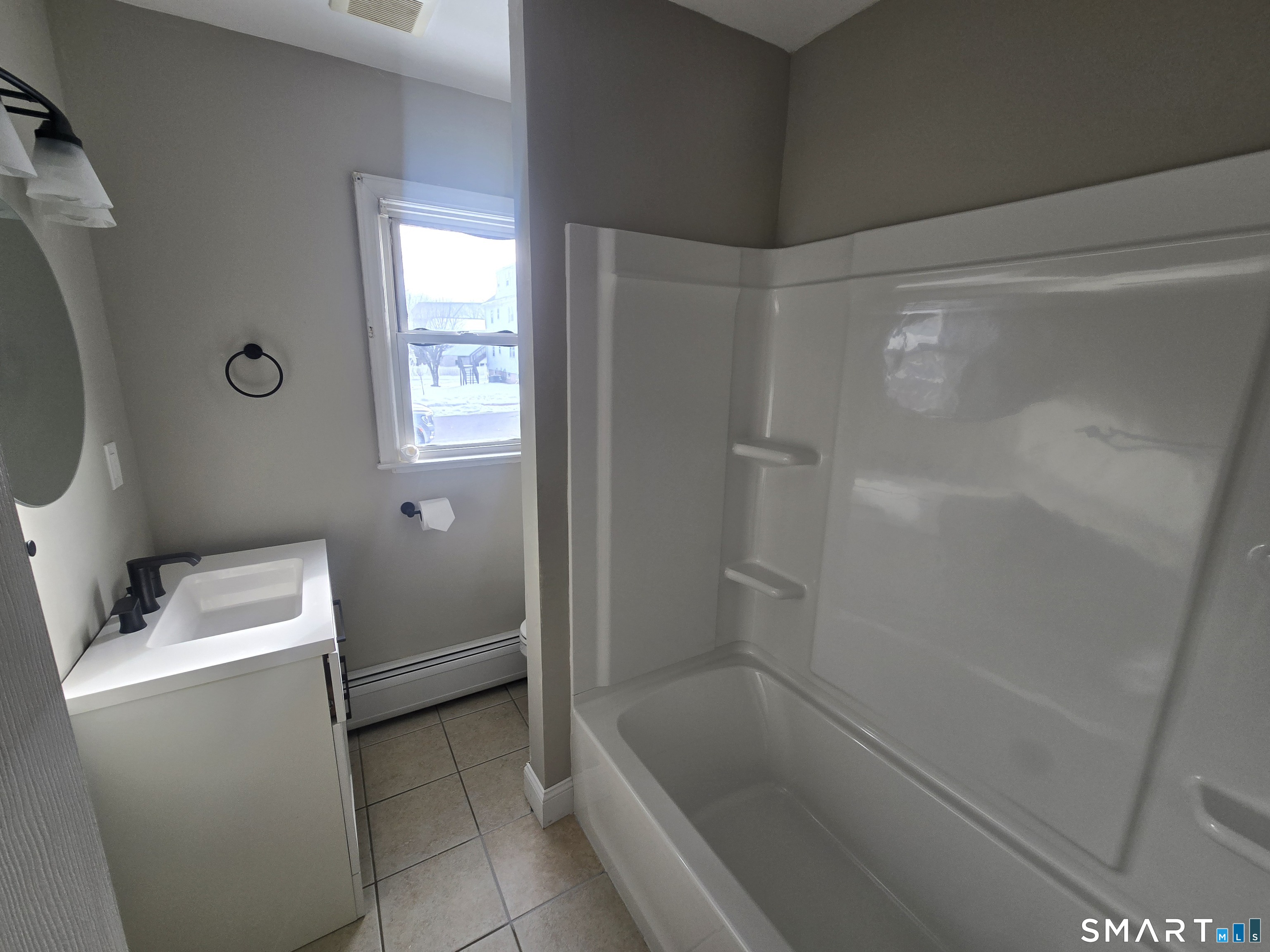 3 Myrtle Avenue Danbury, CT 06810 - Photo 7 of 11 a bathroom with a bathtub and toilet