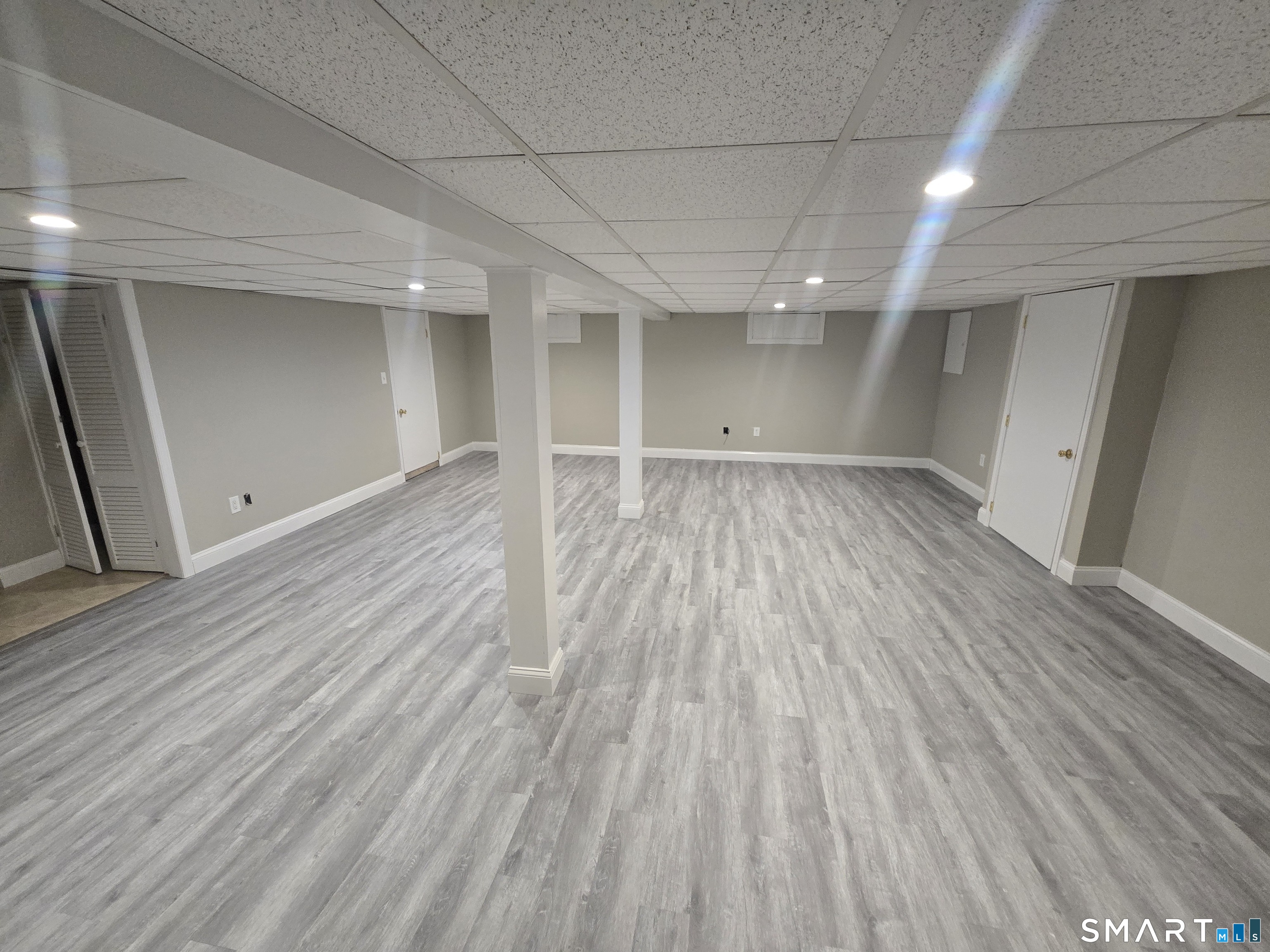 3 Myrtle Avenue Danbury, CT 06810 - Photo 8 of 11 an empty room with wooden floor and windows