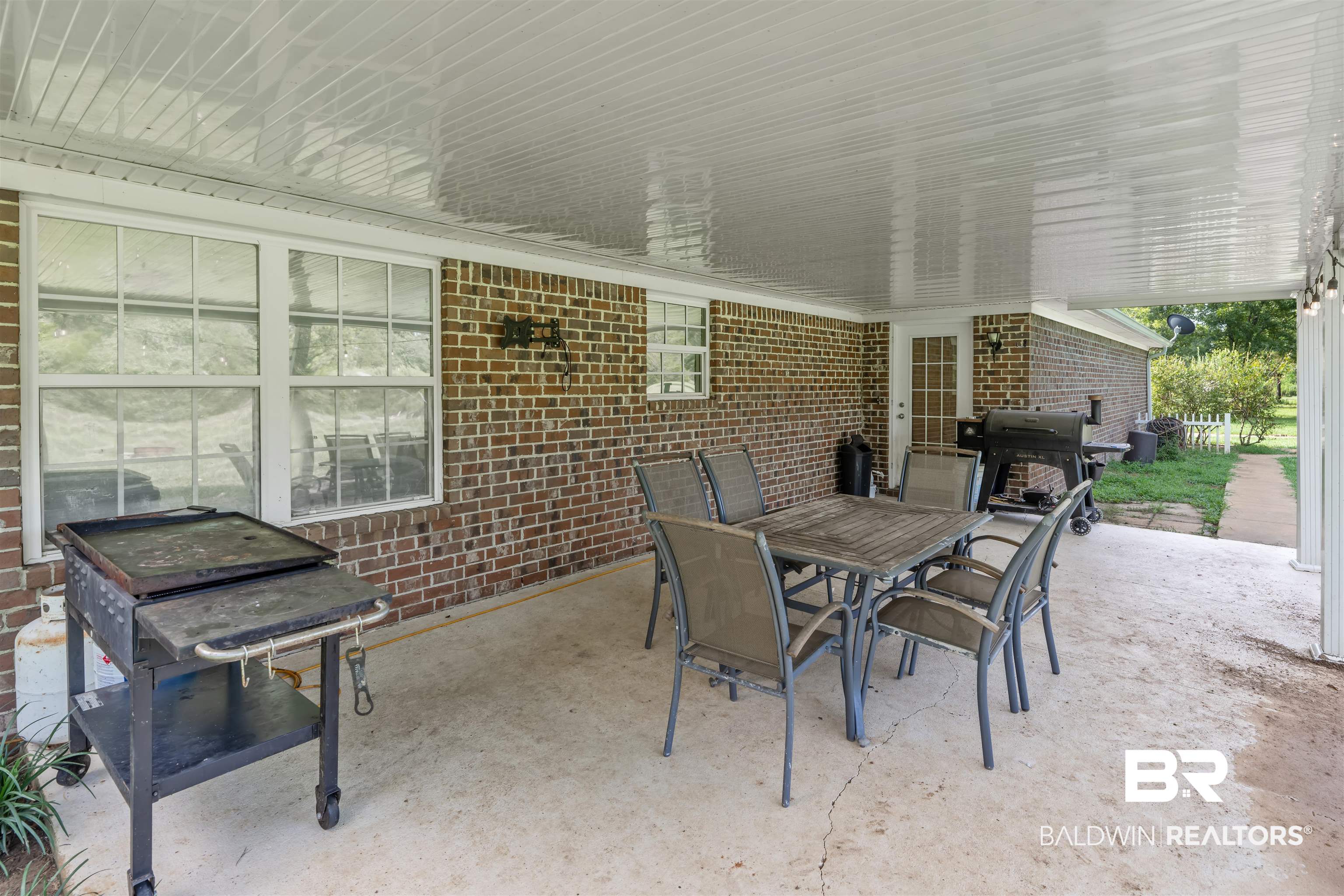 34711 Pond Road Stapleton, AL 36578 - Photo 22 of 38 View of patio / terrace with outdoor dining area and grilling area