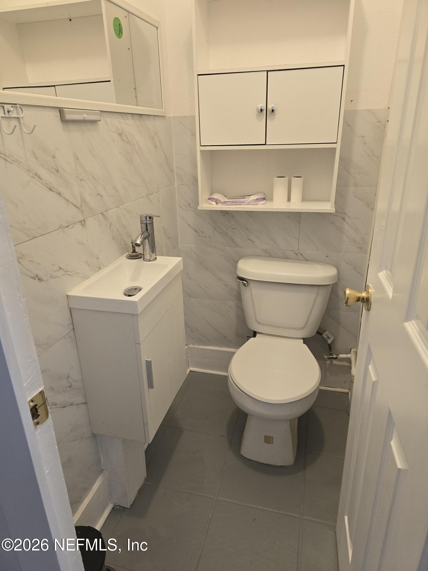 4710 Springfield Boulevard Jacksonville, FL 32206 - Photo 23 of 28 a white toilet sitting next to a bathroom sink