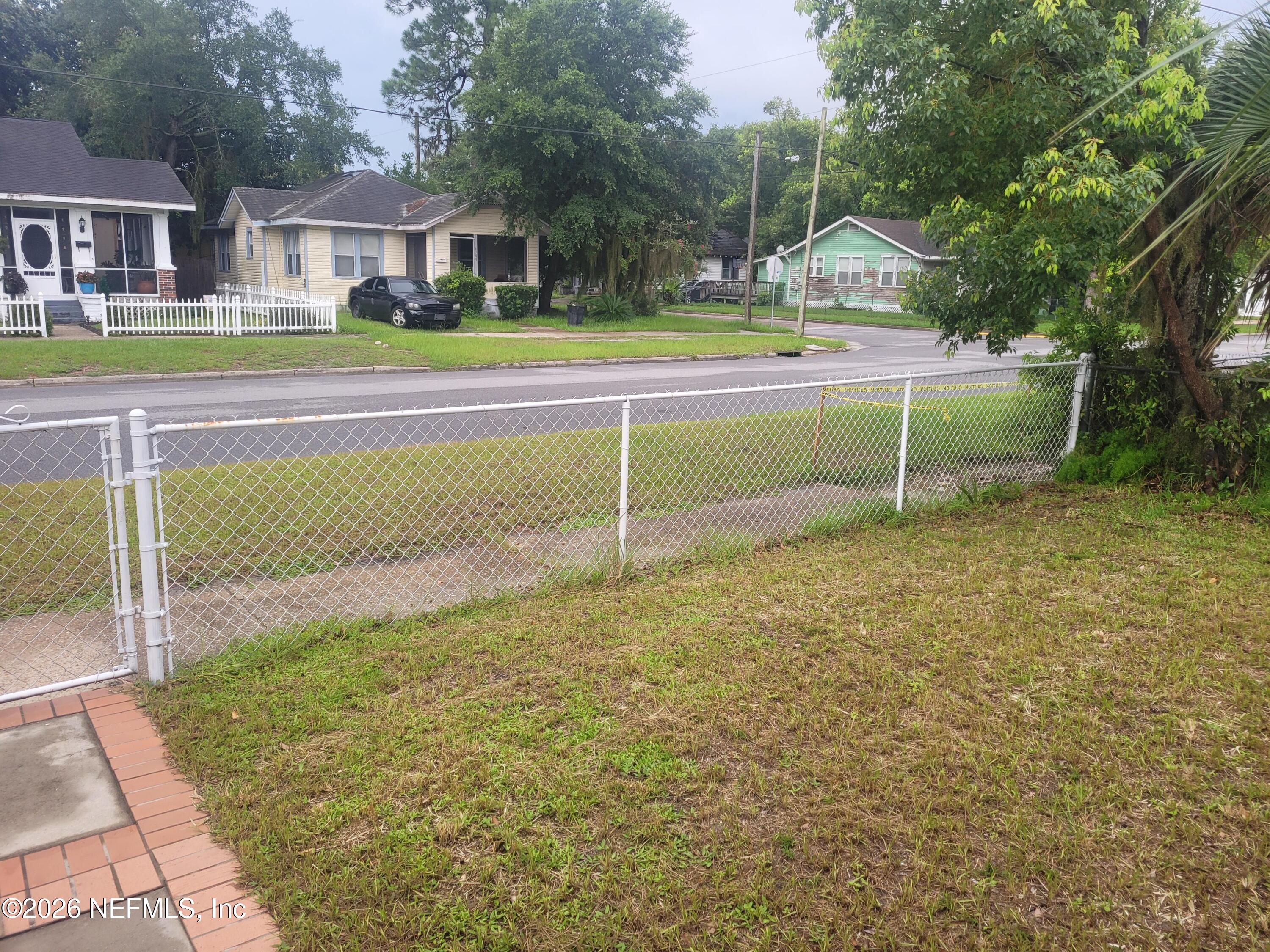 4710 Springfield Boulevard Jacksonville, FL 32206 - Photo 4 of 28 a view of a house with a big yard and large trees