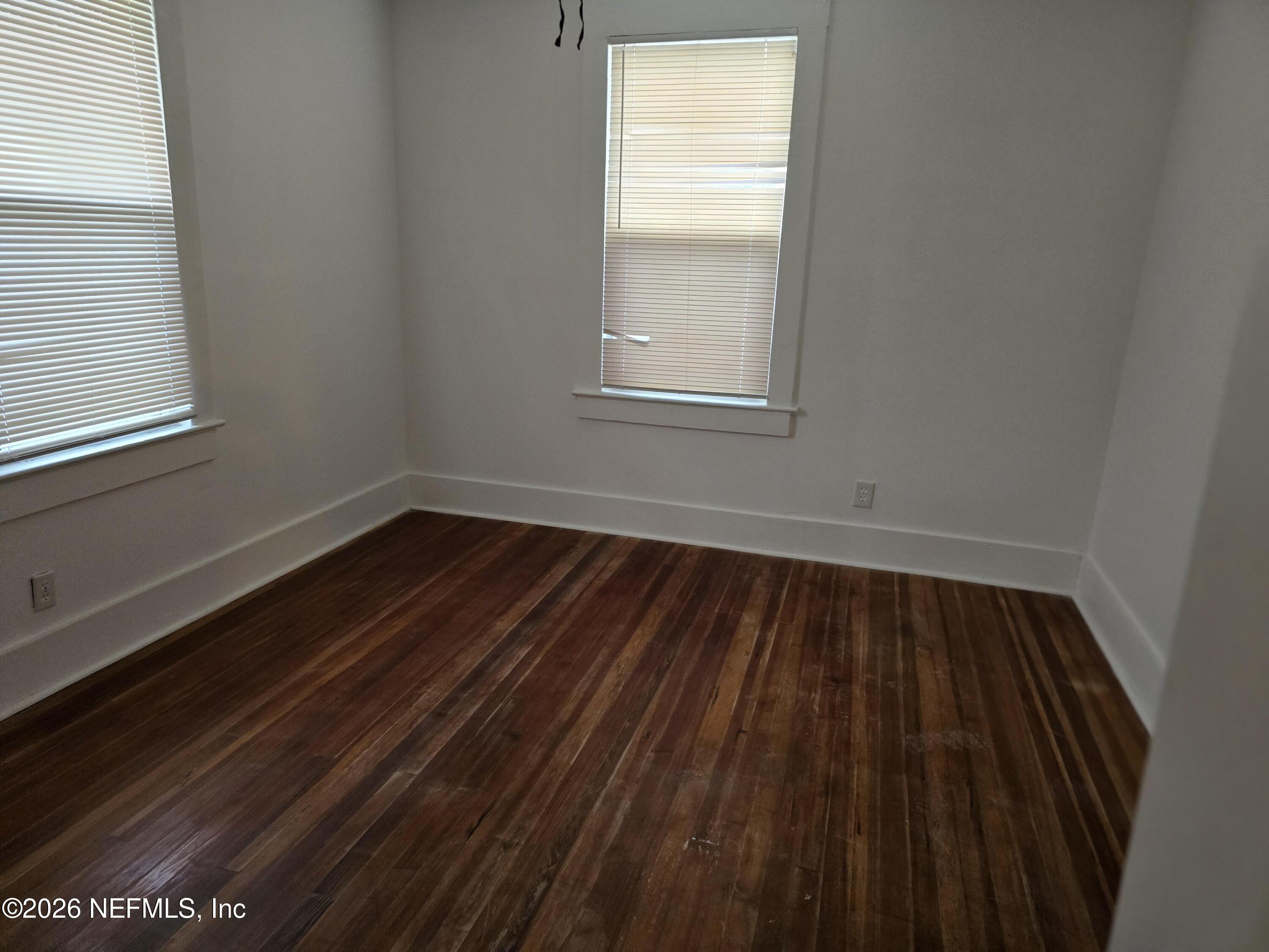4710 Springfield Boulevard Jacksonville, FL 32206 - Photo 10 of 28 a view of a room with wooden floor and window