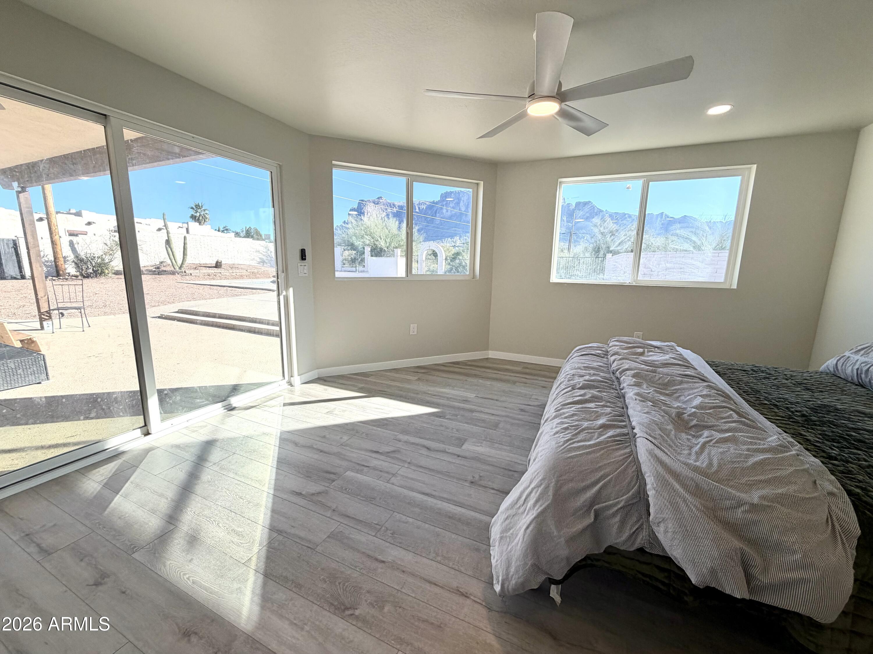 1165 North Mountain View Road Apache Junction, AZ 85119 - Photo 12 of 29 a bed sitting in a bedroom next to a window