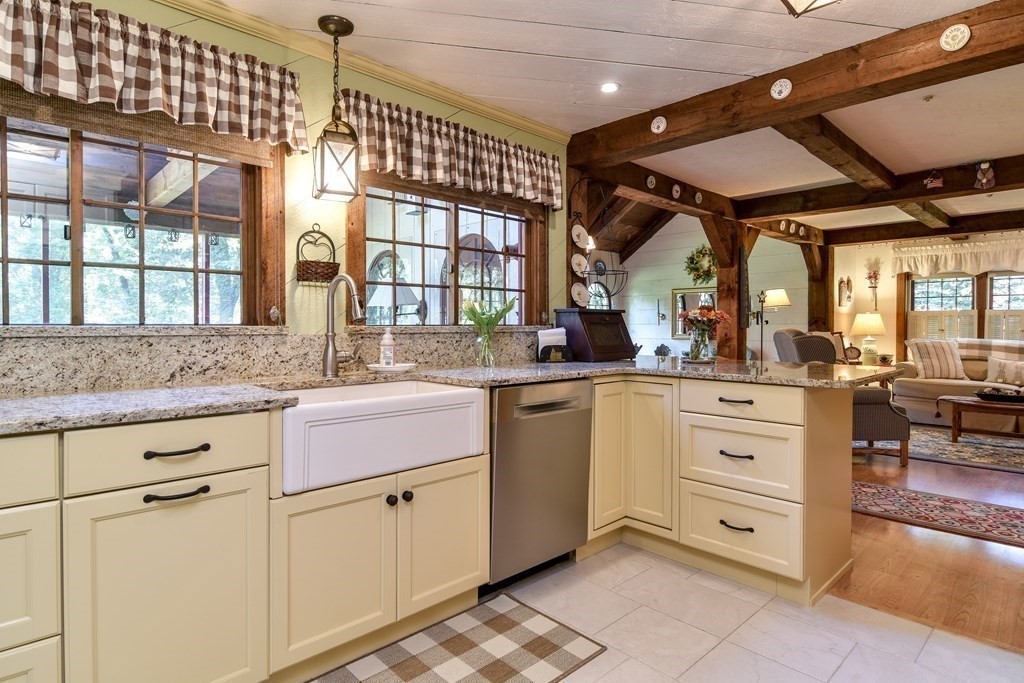 26 Woobly Road Bolton, MA 01740 - Photo 4 of 38 a kitchen with granite countertop white cabinets and white stainless steel appliances