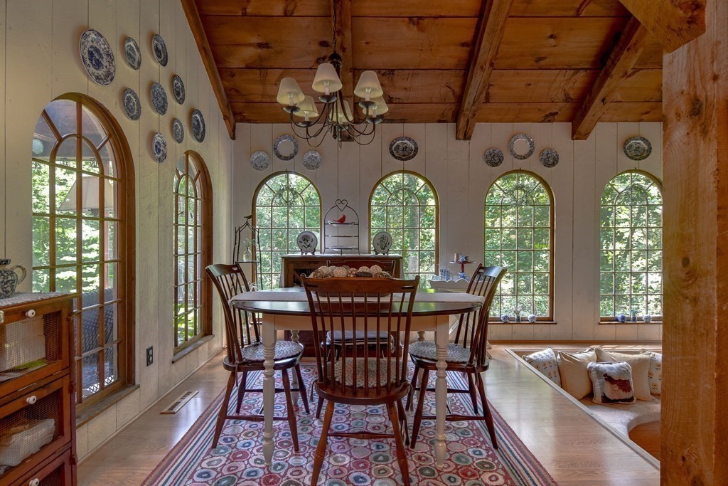 26 Woobly Road Bolton, MA 01740 - Photo 8 of 38 a view of a dining room with furniture a chandelier and wooden floor