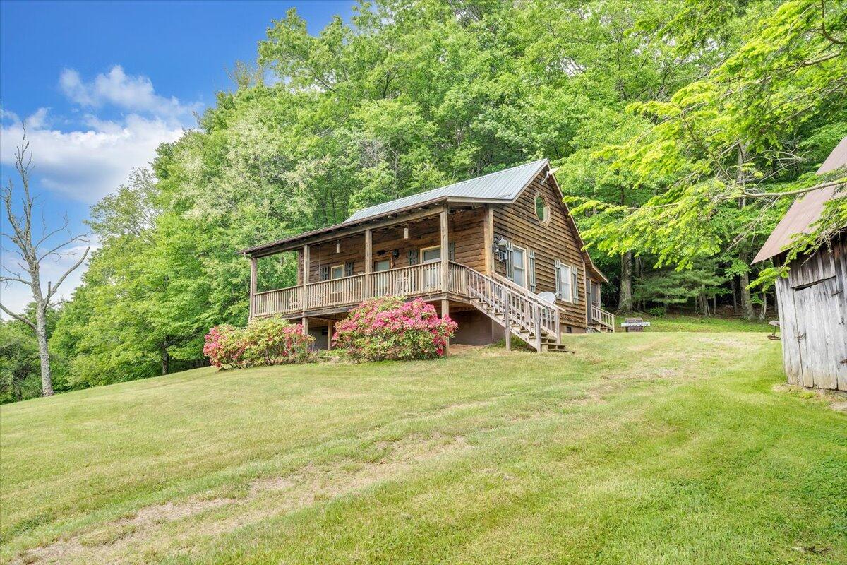 371 Sawmill Road Southwest Willis, VA 24380 - Photo 1 of 52 a view of a house with a yard