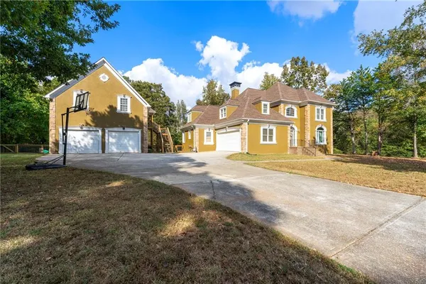 a front view of a house with a yard