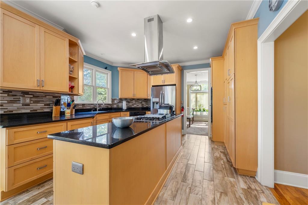 244 Dodgen Road Hampton, GA 30228 - Photo 13 of 55 a kitchen with stainless steel appliances granite countertop a sink a stove and a refrigerator