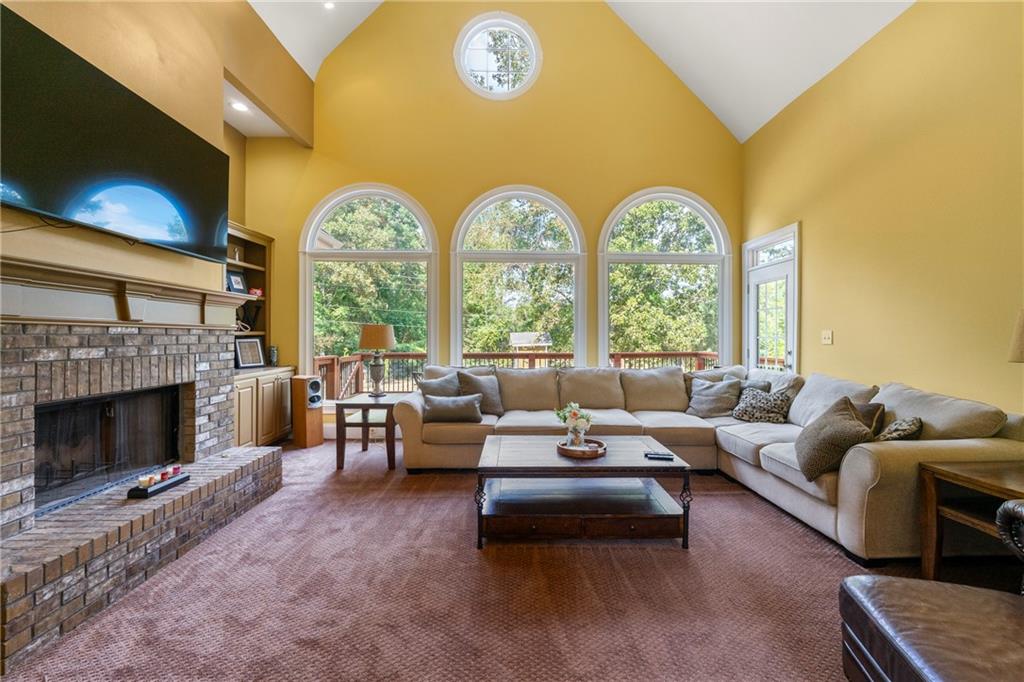 244 Dodgen Road Hampton, GA 30228 - Photo 19 of 55 a living room with fireplace furniture and a large window