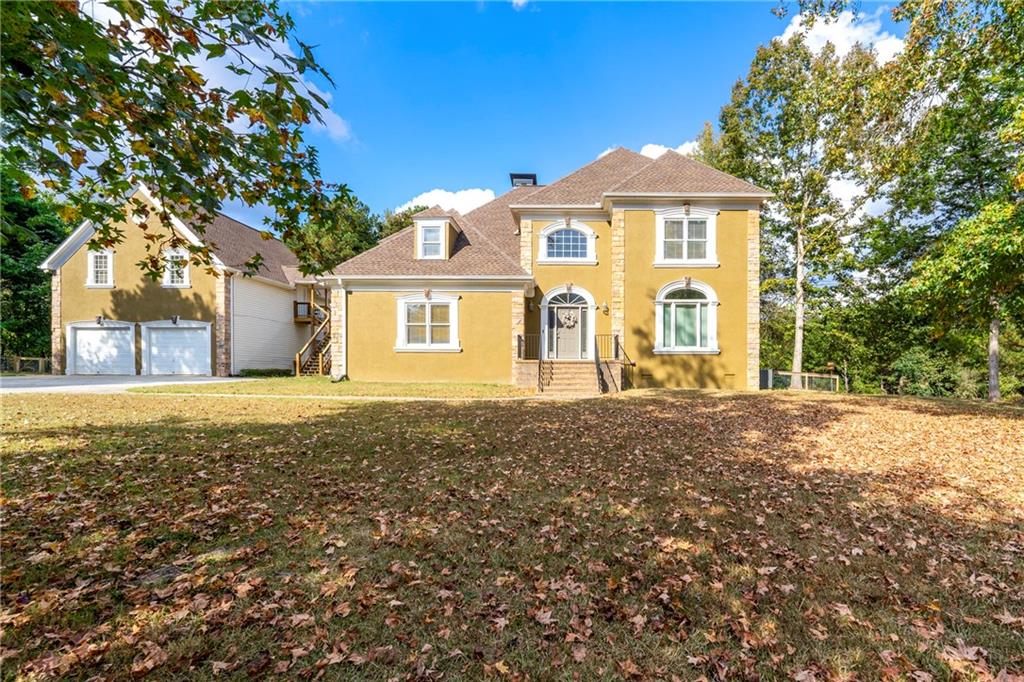 244 Dodgen Road Hampton, GA 30228 - Photo 2 of 55 a front view of a house with a yard