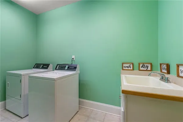a kitchen with a sink and a large mirror