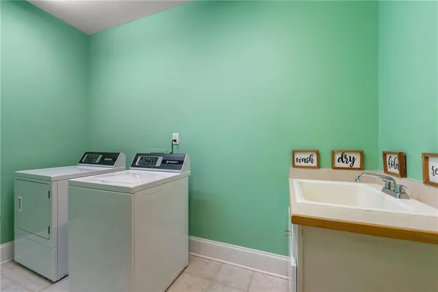 a kitchen with a sink and a large mirror