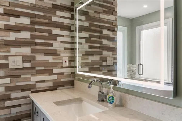 a bathroom with a double vanity sink and mirror