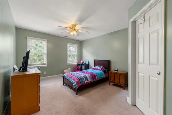 a bedroom with furniture and a window