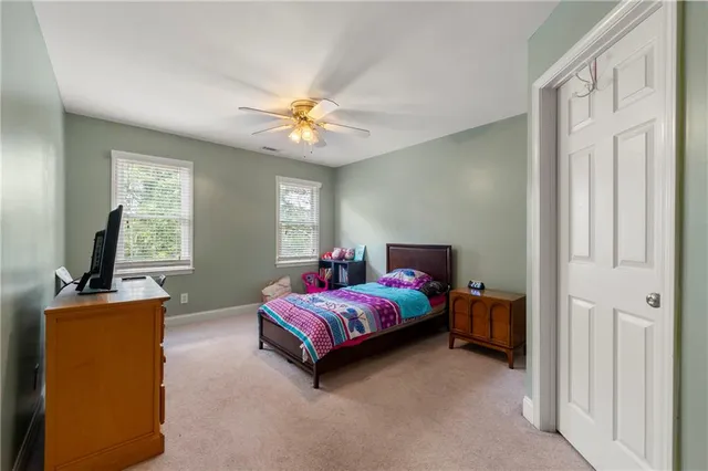 a bedroom with furniture and a window